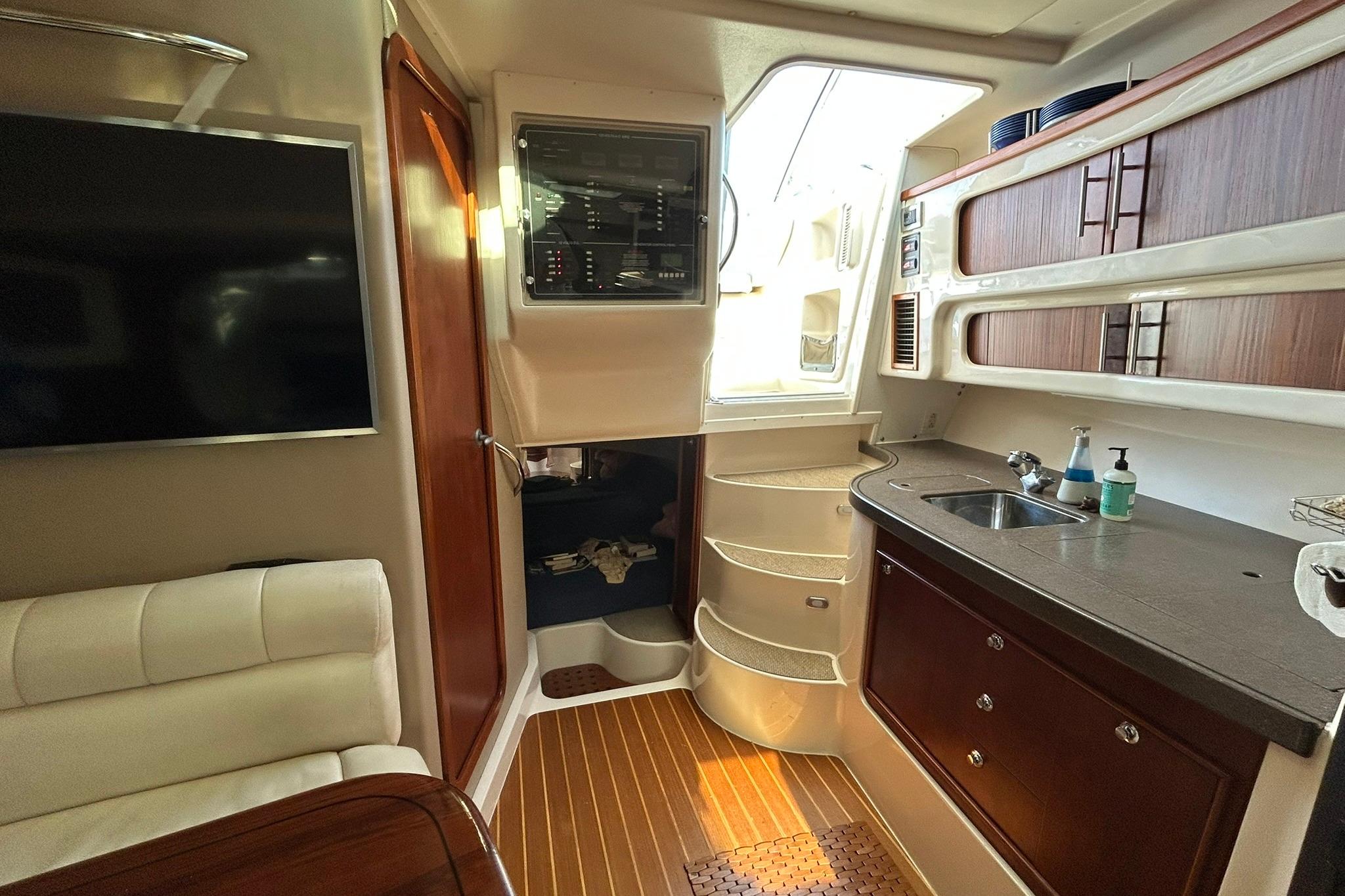 Interior of 2007 Grady-White Express 360 boat with kitchenette and seating area.