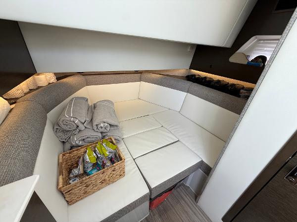 Interior of 2020 Cruisers Yachts 38 GLS OB with cozy seating and amenities.