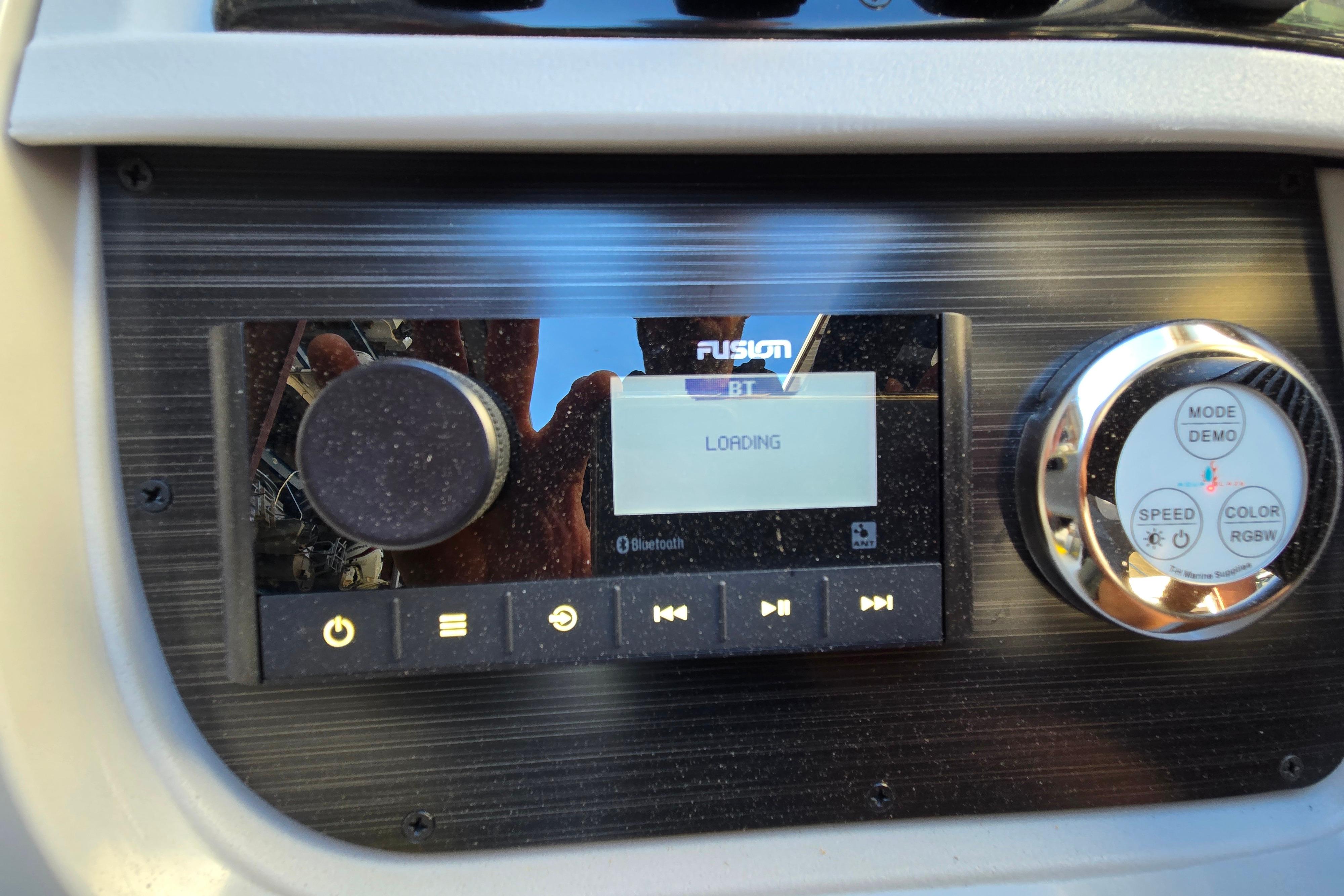 2024 Godfrey Sweetwater 2486 SB boat dashboard with Fusion Bluetooth stereo system.