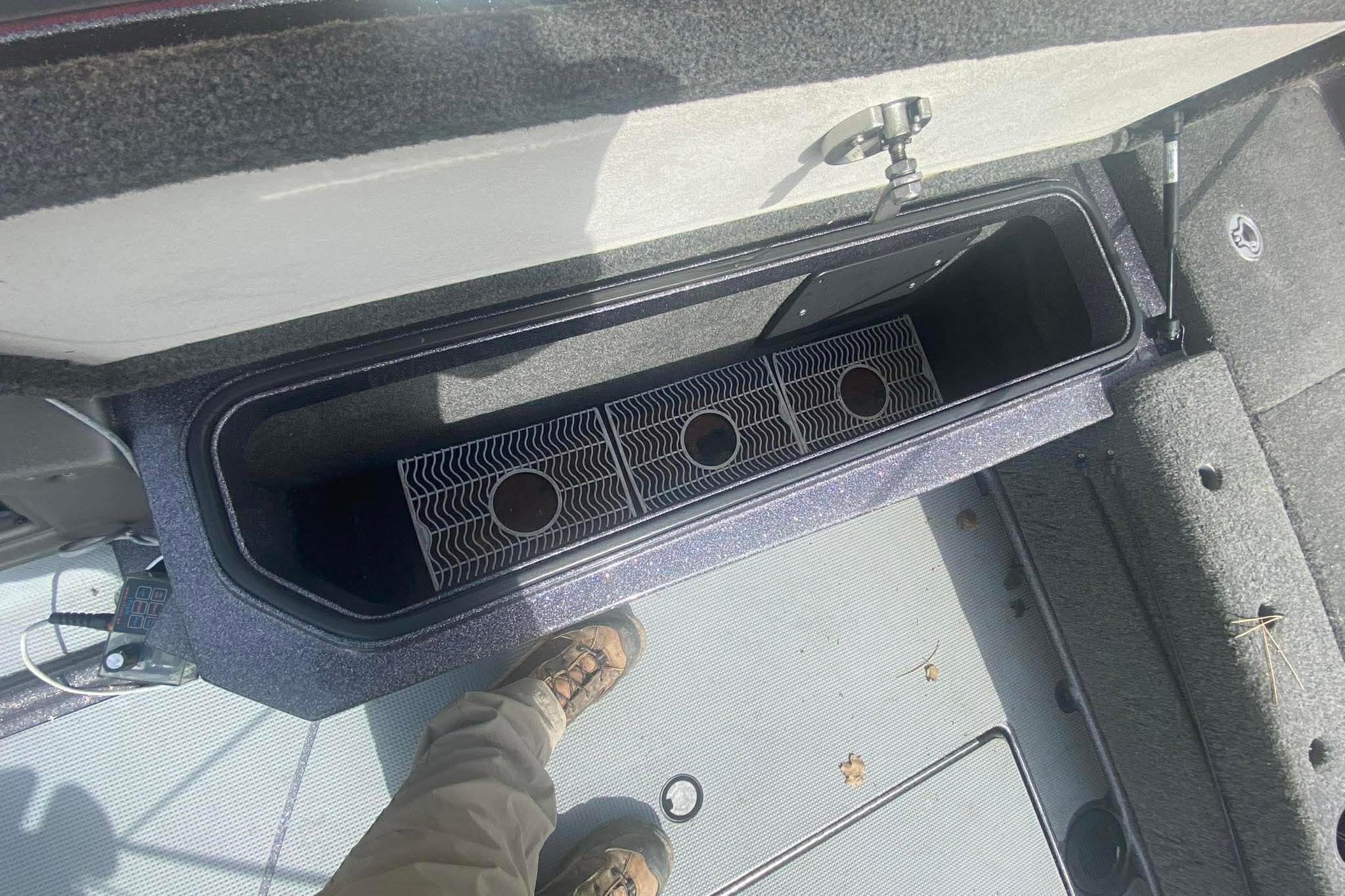2017 Ranger 621FS Fisherman boat storage compartment with open lid and interior view.
