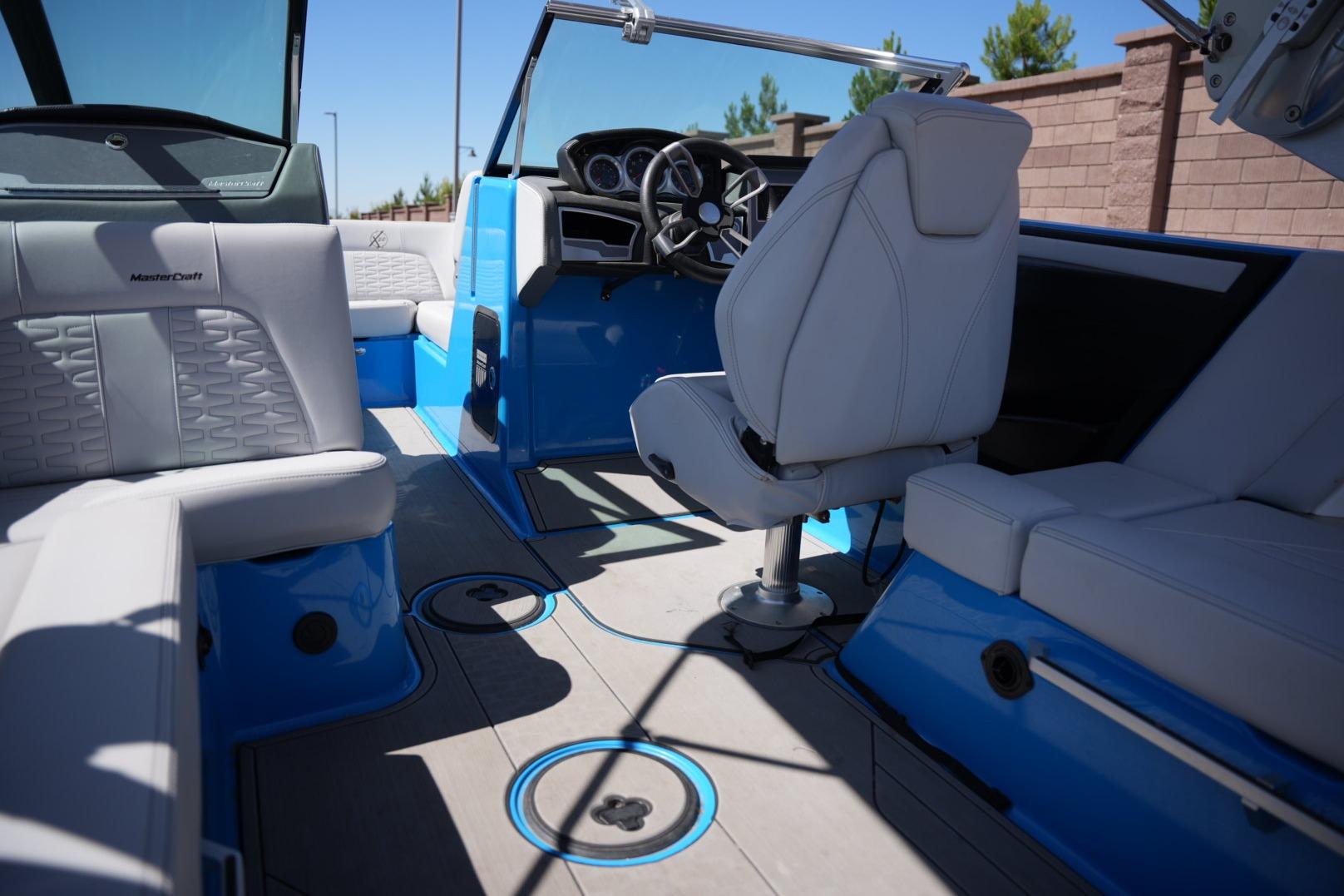 2020 MasterCraft X22 boat interior with blue accents and luxurious seating.