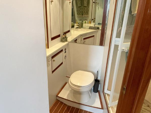 Bathroom interior of 2000 Novatec Islander 55 yacht with toilet and shower.