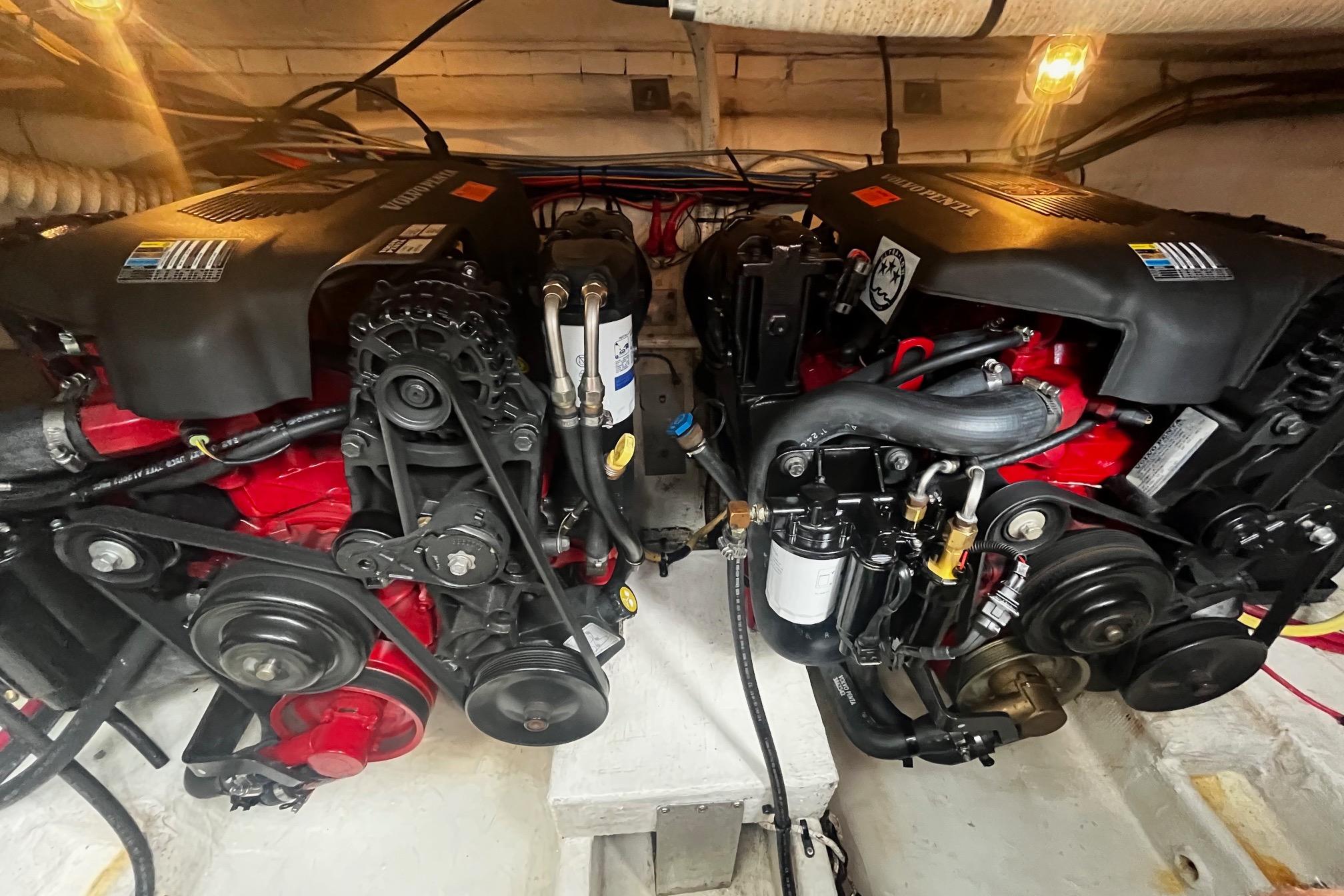 Engine compartment of a 2004 Cruisers Yachts 280 CXi Express, showcasing dual engines.