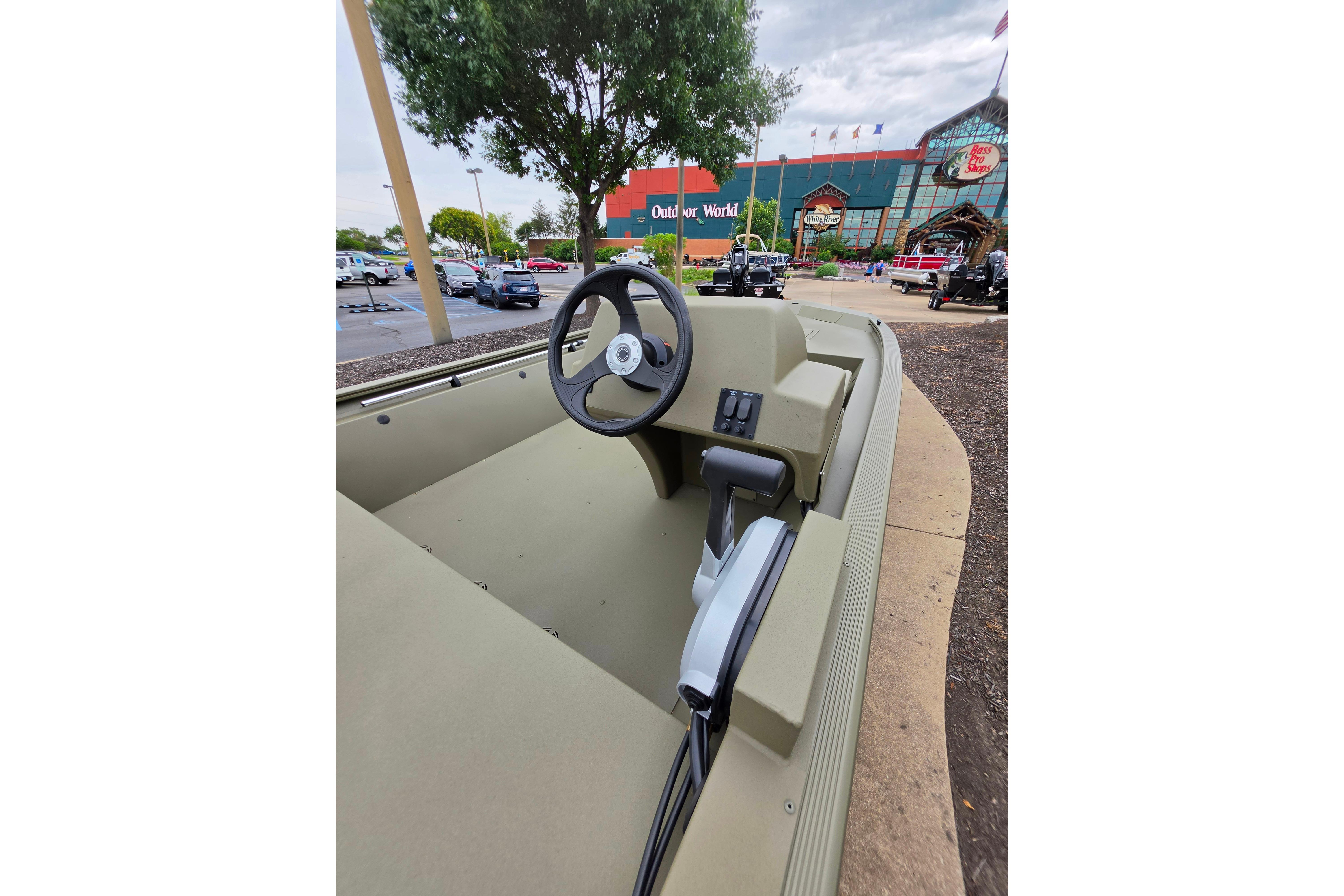 2026 Tracker Grizzly 1648 SC boat displayed outside Bass Pro Shops.