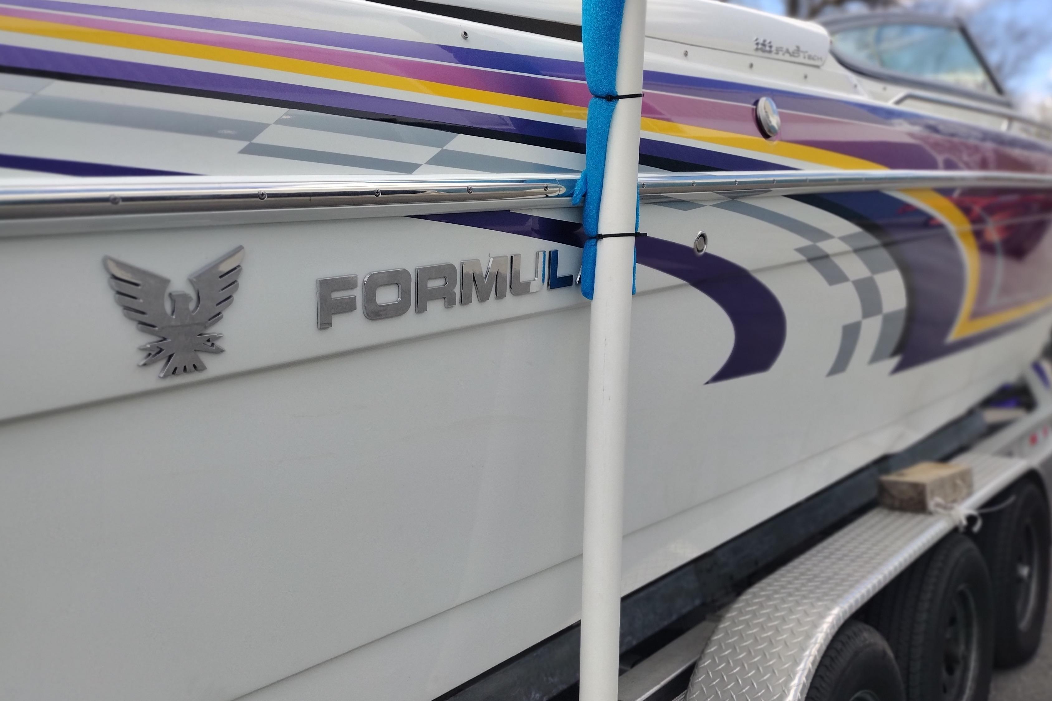 2006 Formula 353 FASTech boat with vibrant graphics on a trailer.