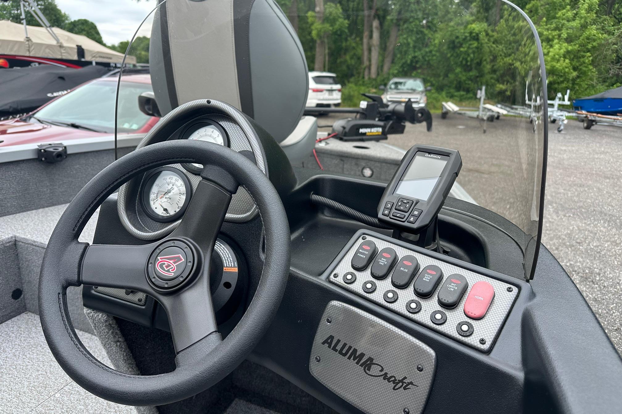 2022 Alumacraft Classic 165 CS dashboard with steering wheel and control panel.