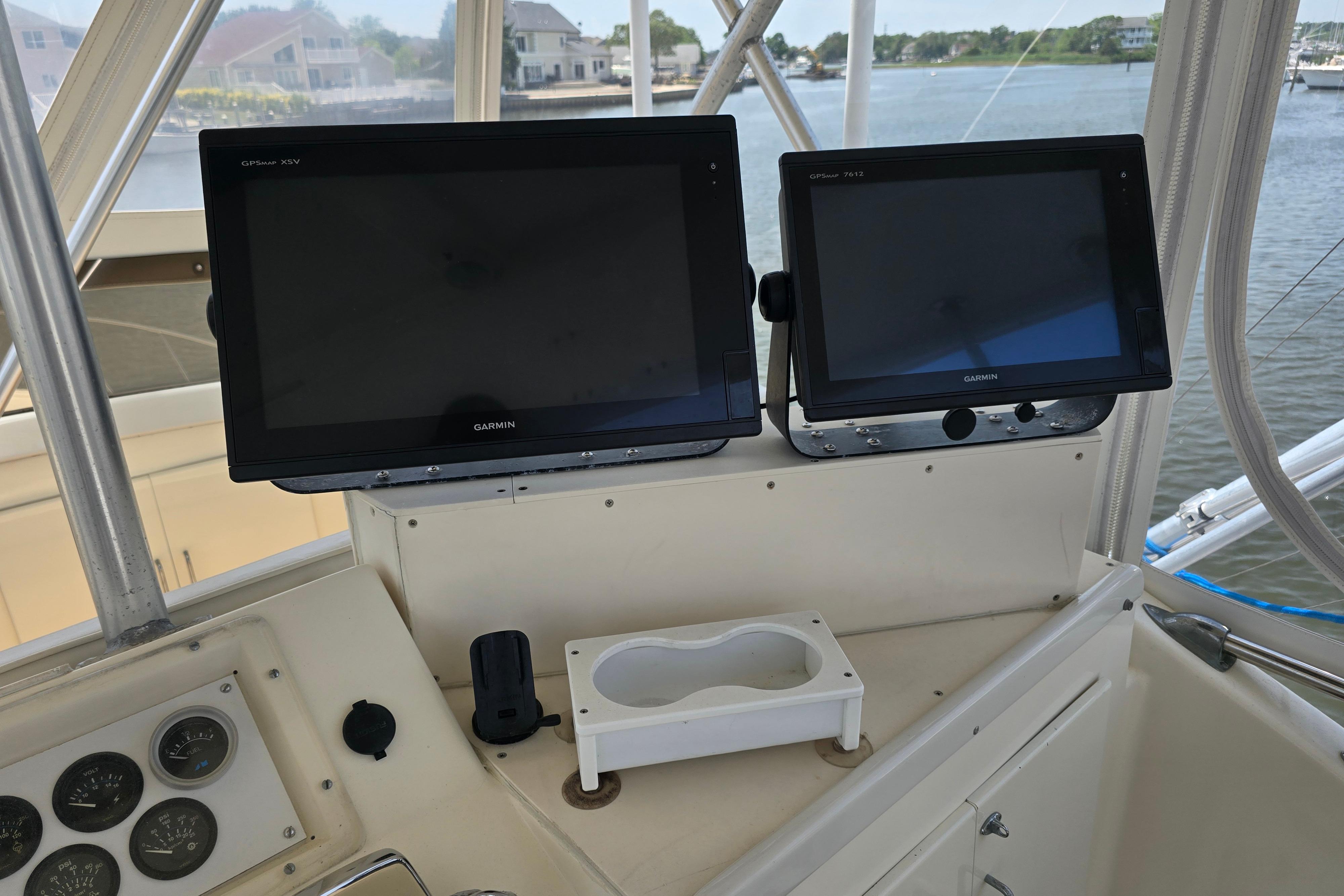 Control panel of a 1988 Post 46 Convertible boat with Garmin GPS displays.