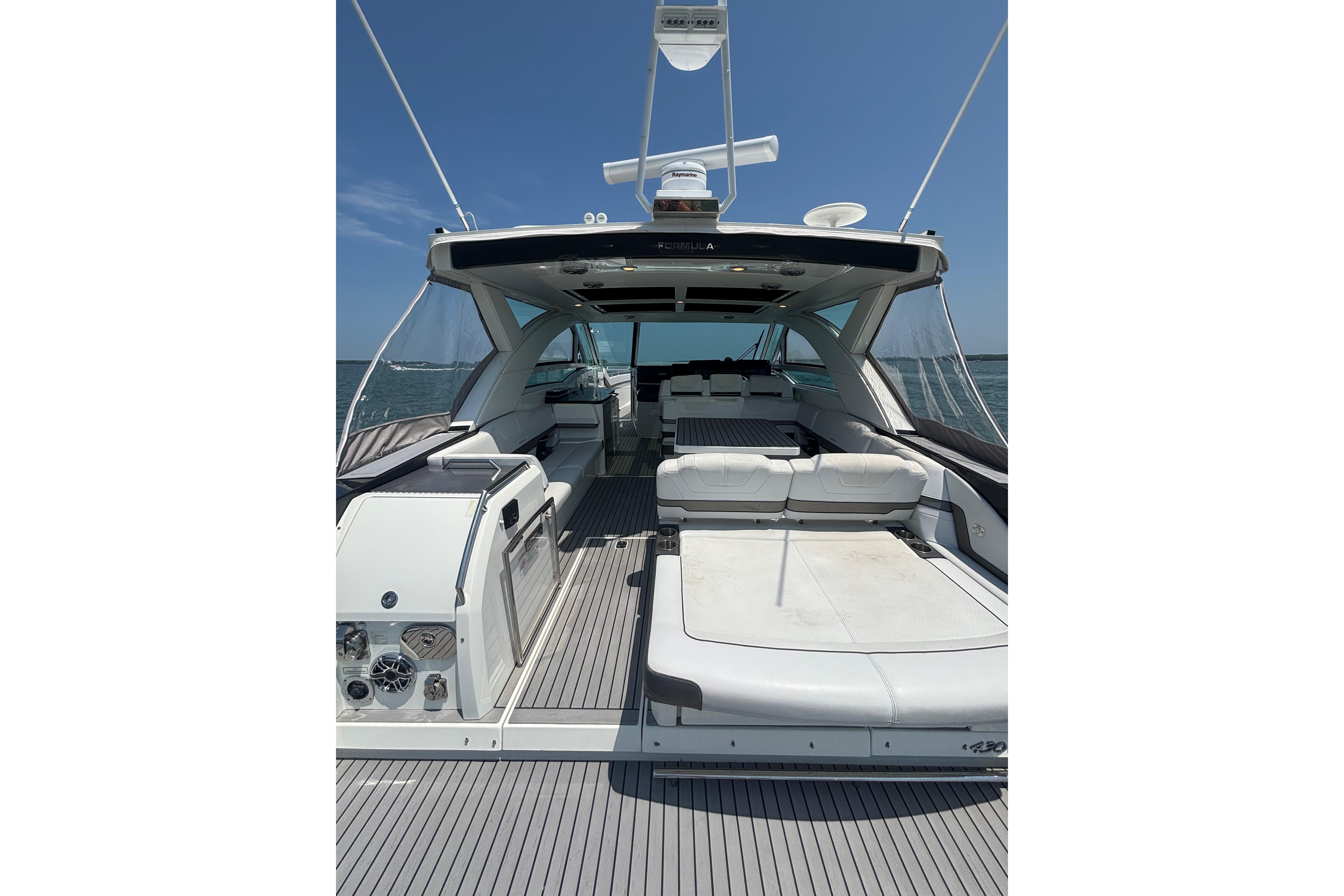 2019 Formula 430 Super Sport Crossover yacht with spacious deck and luxurious seating.
