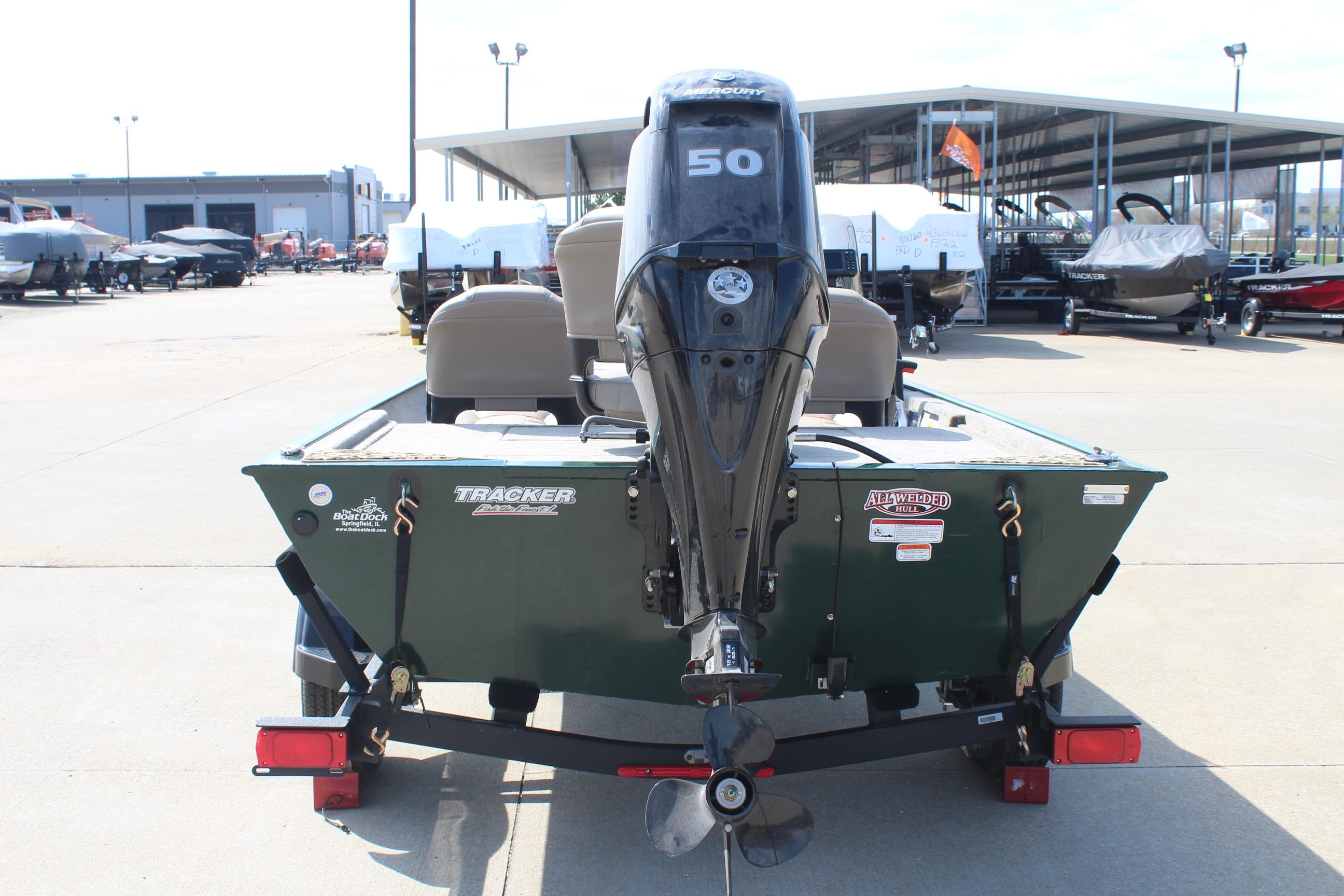 2026 Tracker Bass Tracker Classic Limited boat with 50 HP motor, displayed outdoors.