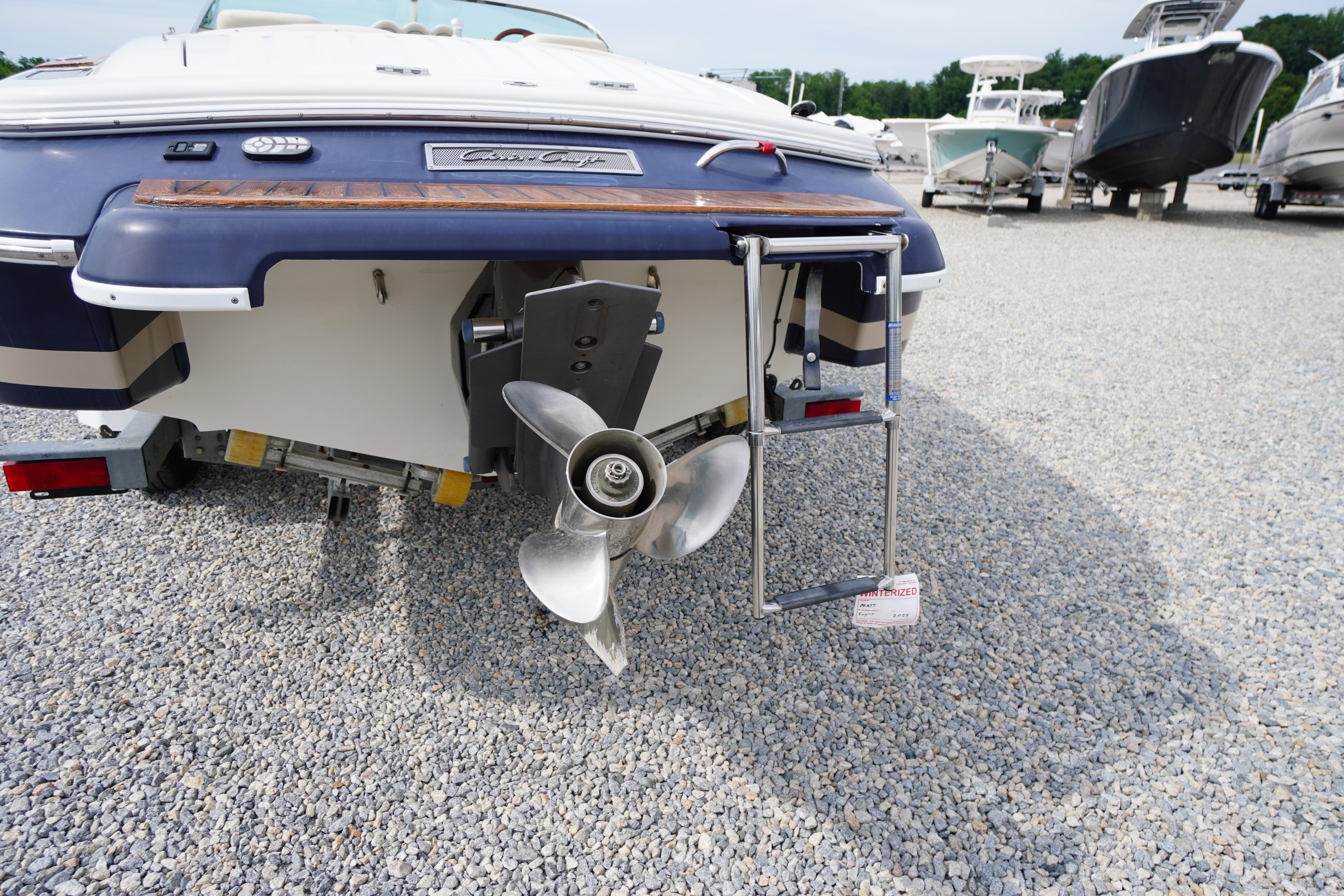 Rear view of 2005 Chris Craft Speedster Heritage boat with propeller and ladder.