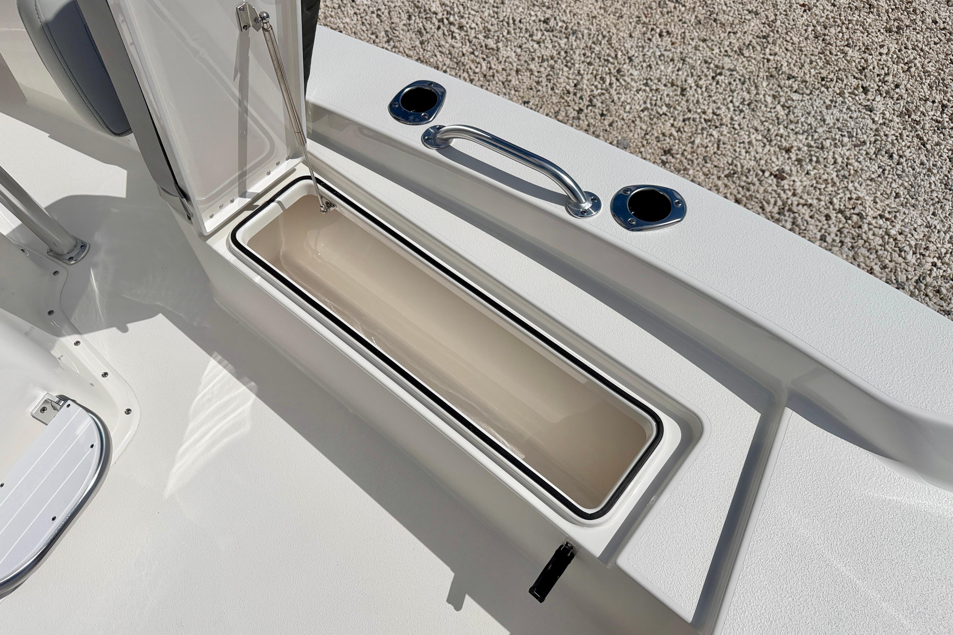 2026 Bay Rider 219 Bay boat storage compartment with open lid, showcasing sleek design and functionality.