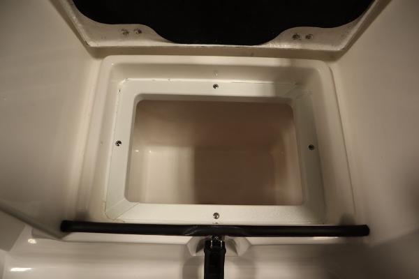 2025 Sea Fox 228 Commander storage compartment, open and empty.