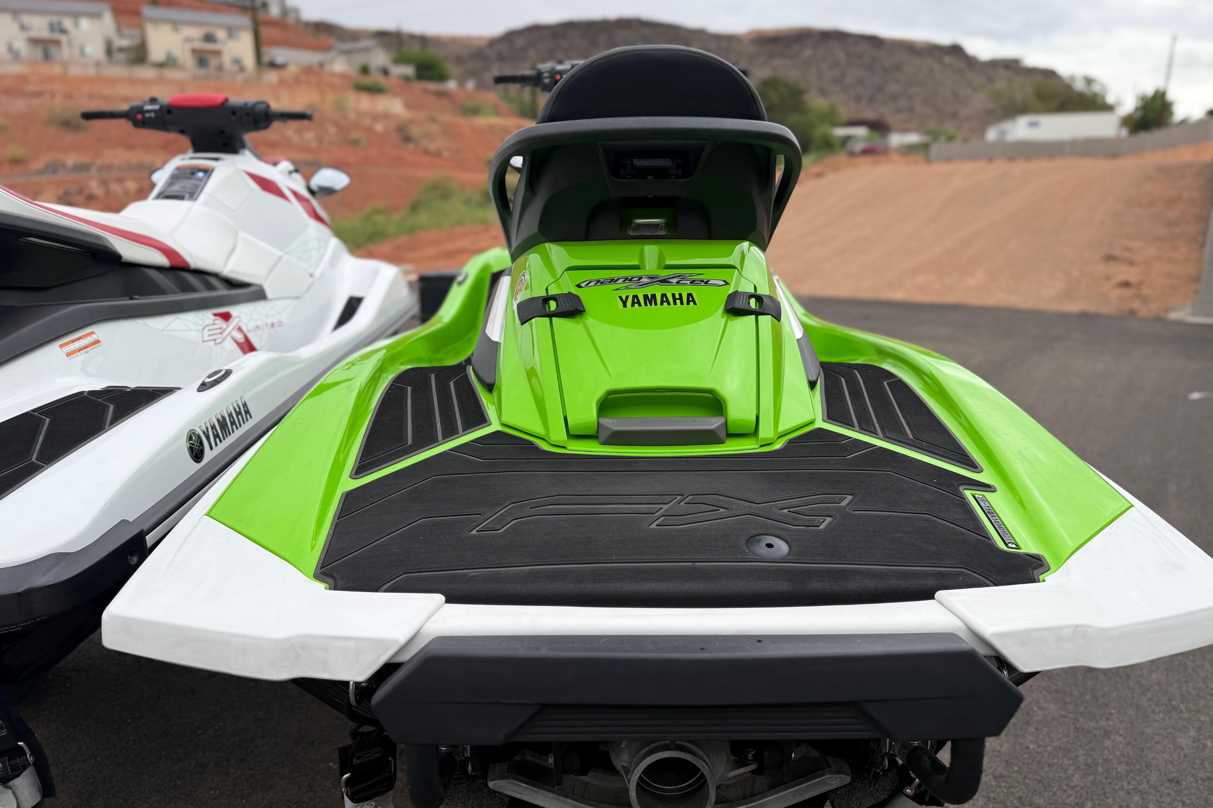 2021 Yamaha WaveRunner FX Cruiser HO in vibrant green, parked on a paved surface.