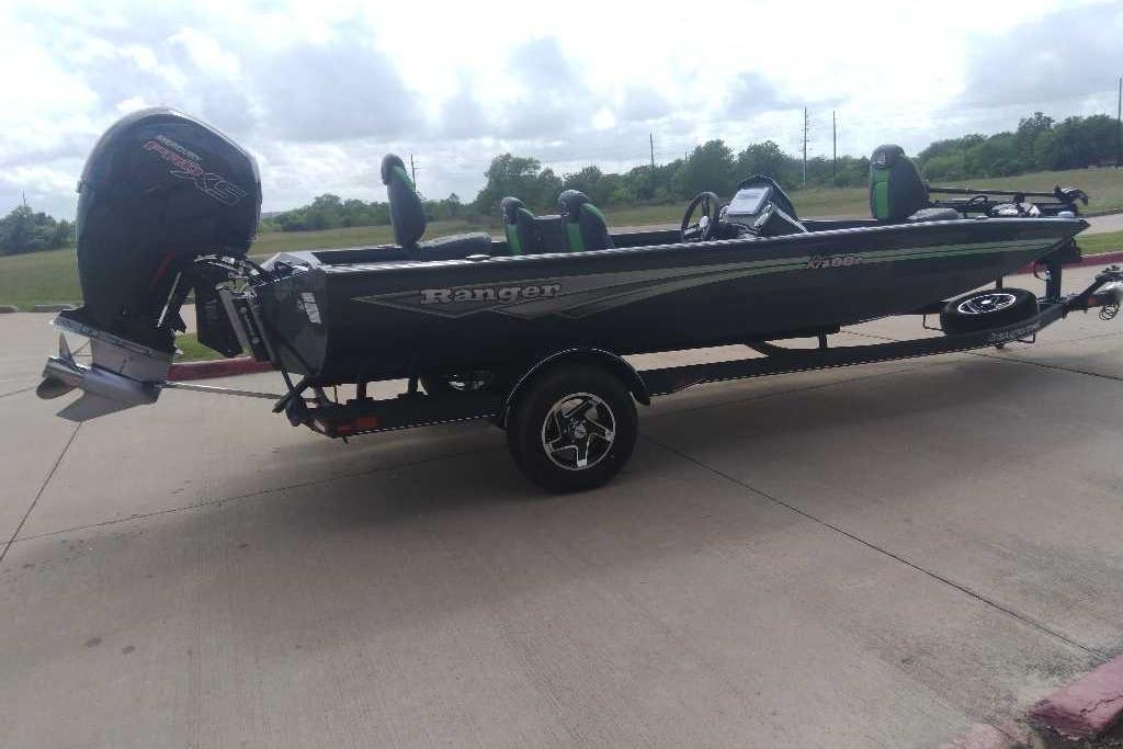 2026 Ranger RT198P boat on trailer, parked outdoors under cloudy sky.