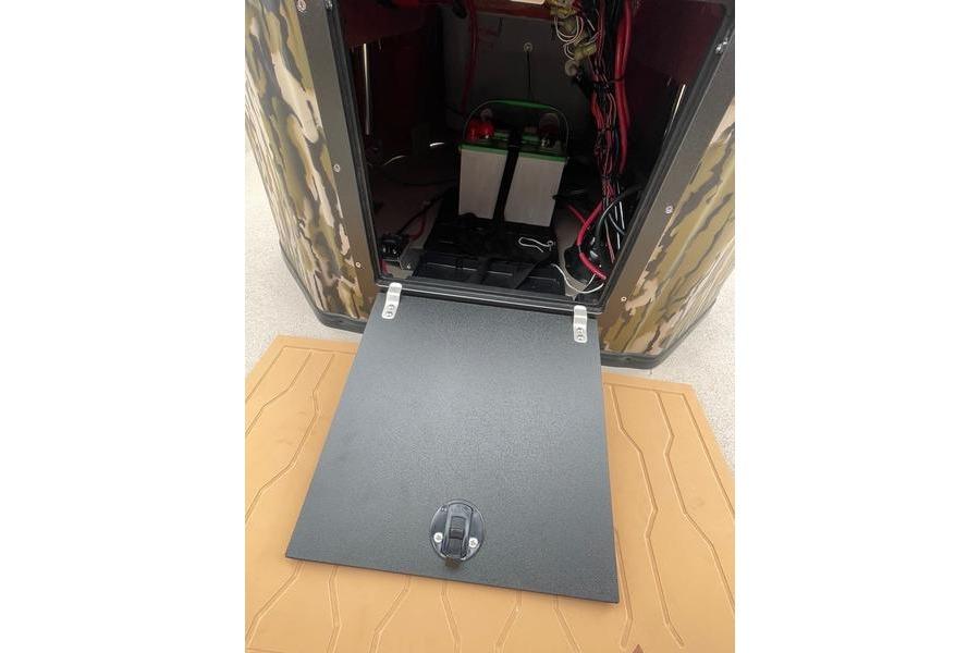 Open compartment of 2026 Avid 21 FSX boat showing battery and wiring.