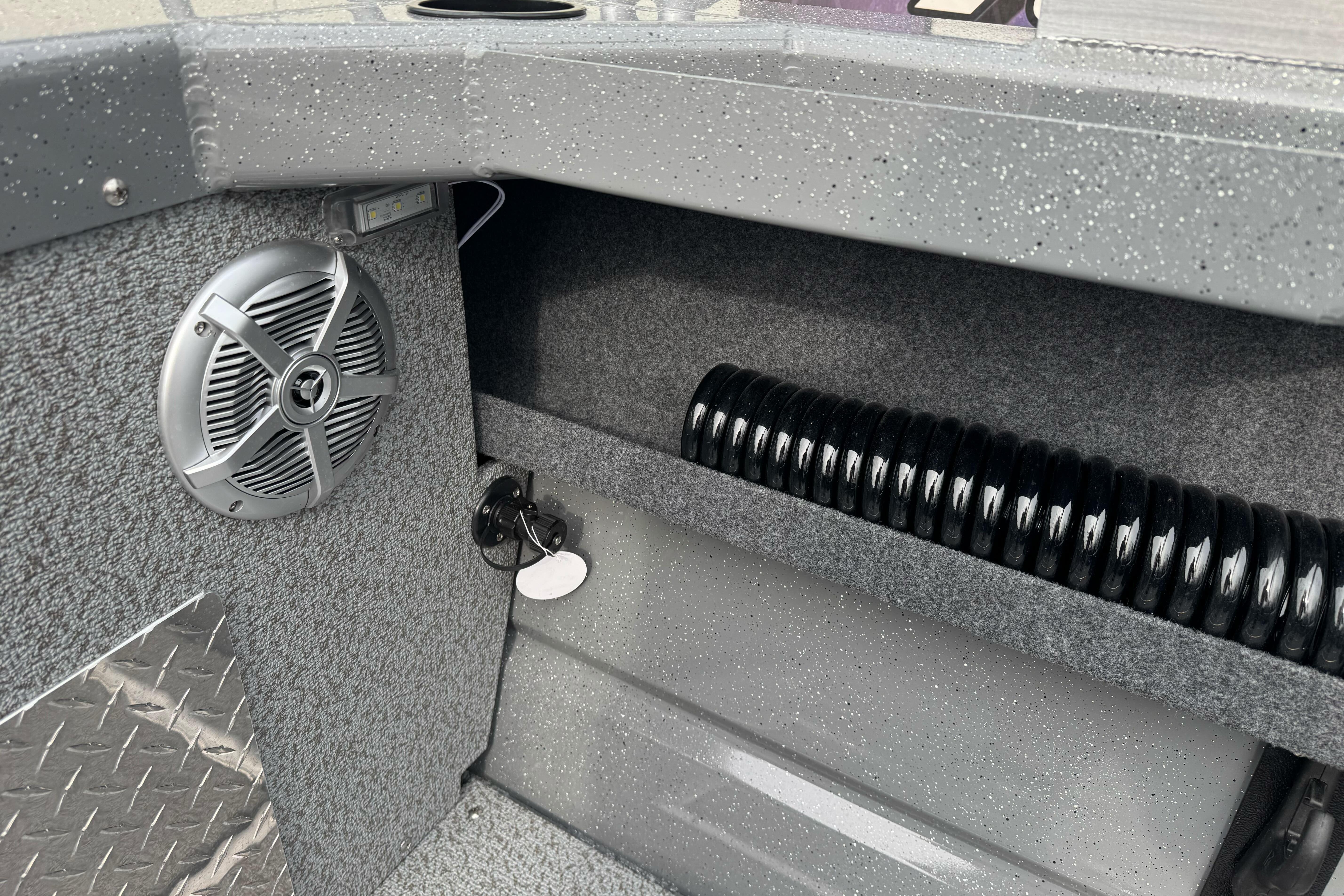 2026 Lund 185 Heavy Gauge boat interior with speaker and storage compartment.