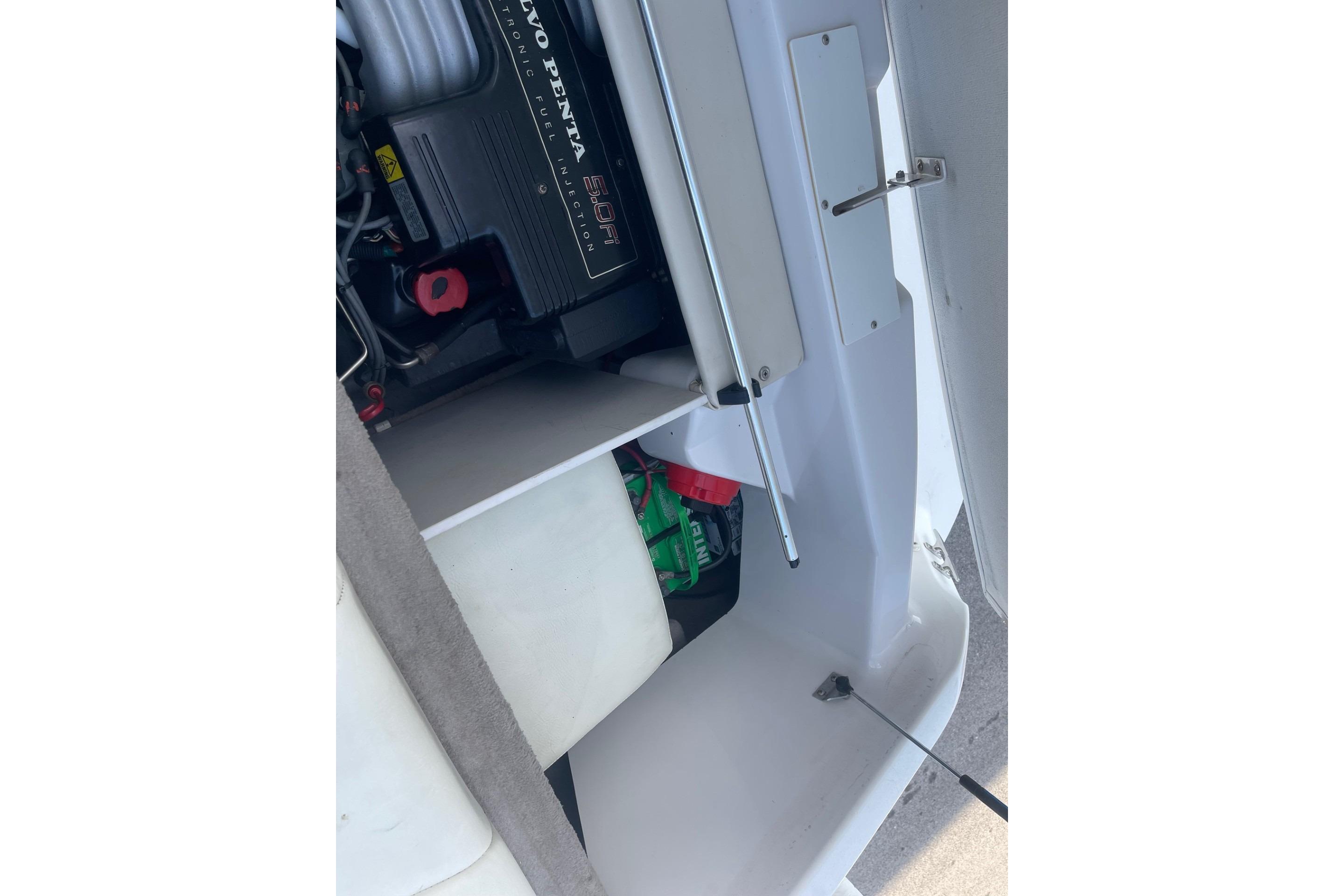 1996 Four Winns 200 Horizon boat engine compartment with Volvo Penta engine visible.