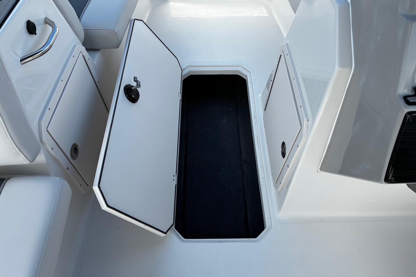 2026 Starcraft SVX 191 OB boat storage compartment with open hatch.