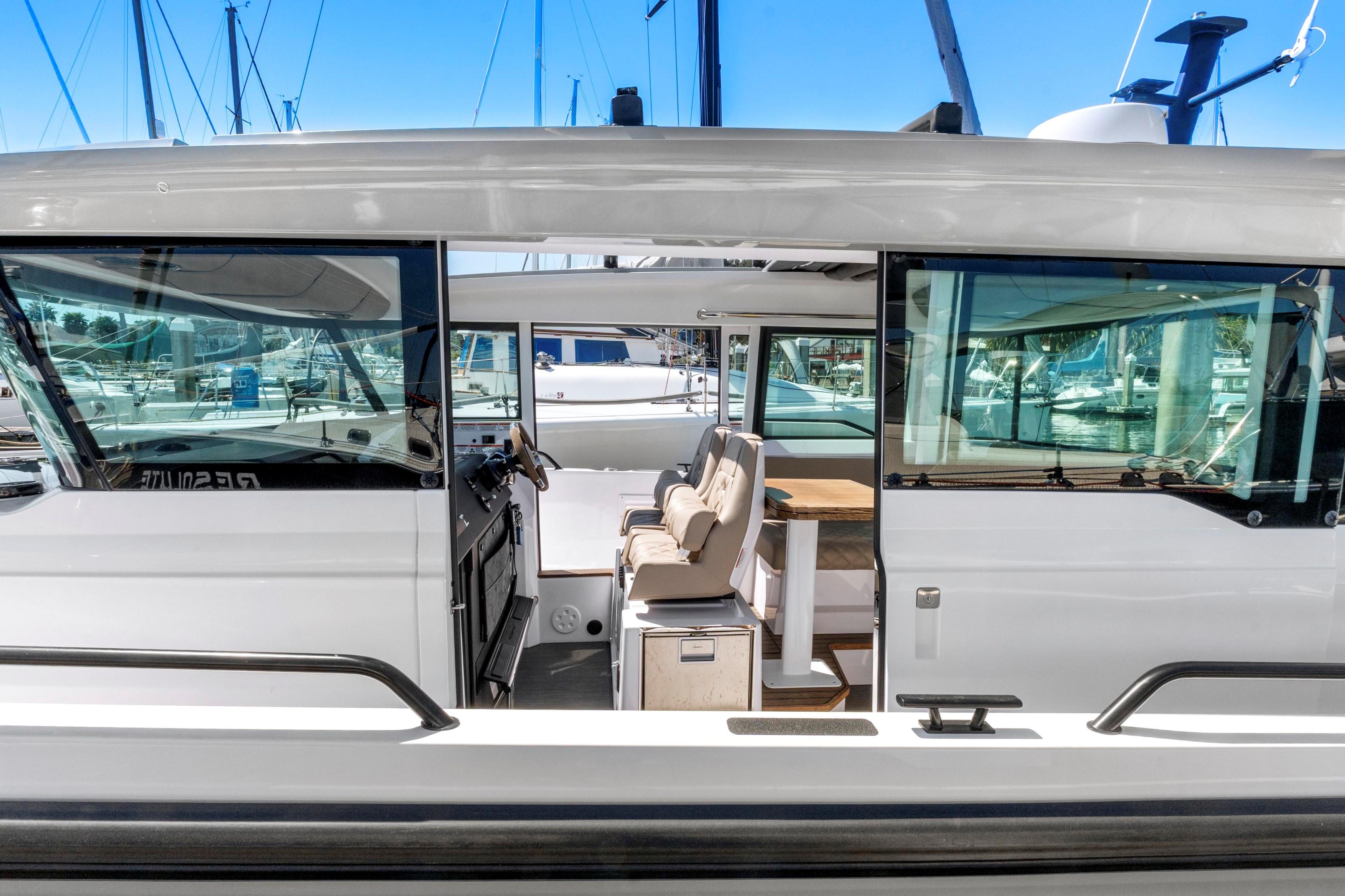2022 Axopar 37 Cross Cabin Brabus Trim, side view, showcasing interior seating and helm.