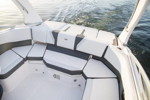 Manufacturer Provided Image: 2026 Regal 2000 ES boat interior with white and gray seating, on calm water.