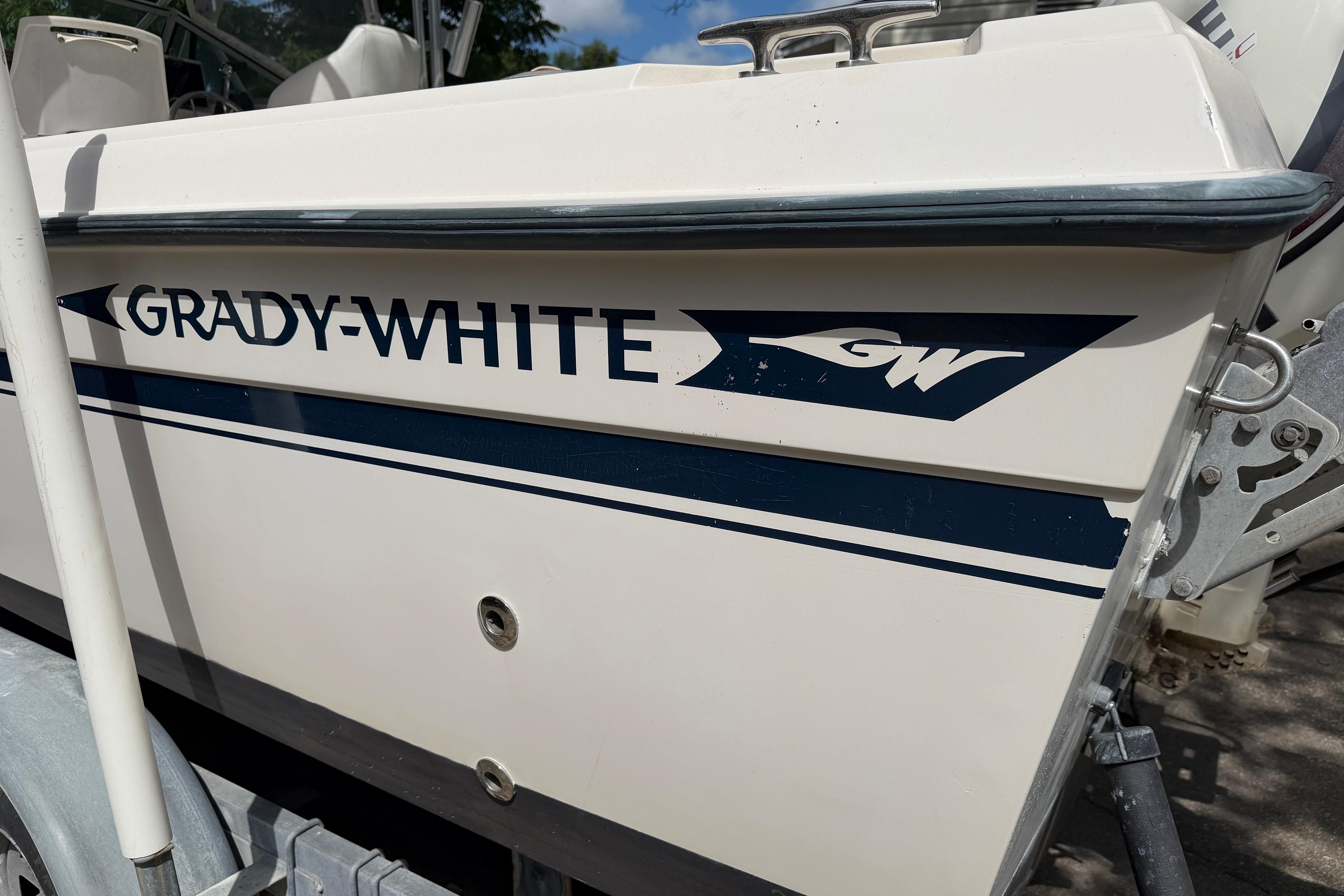 1987 Grady-White Seafarer 226 boat side view with logo and trailer.