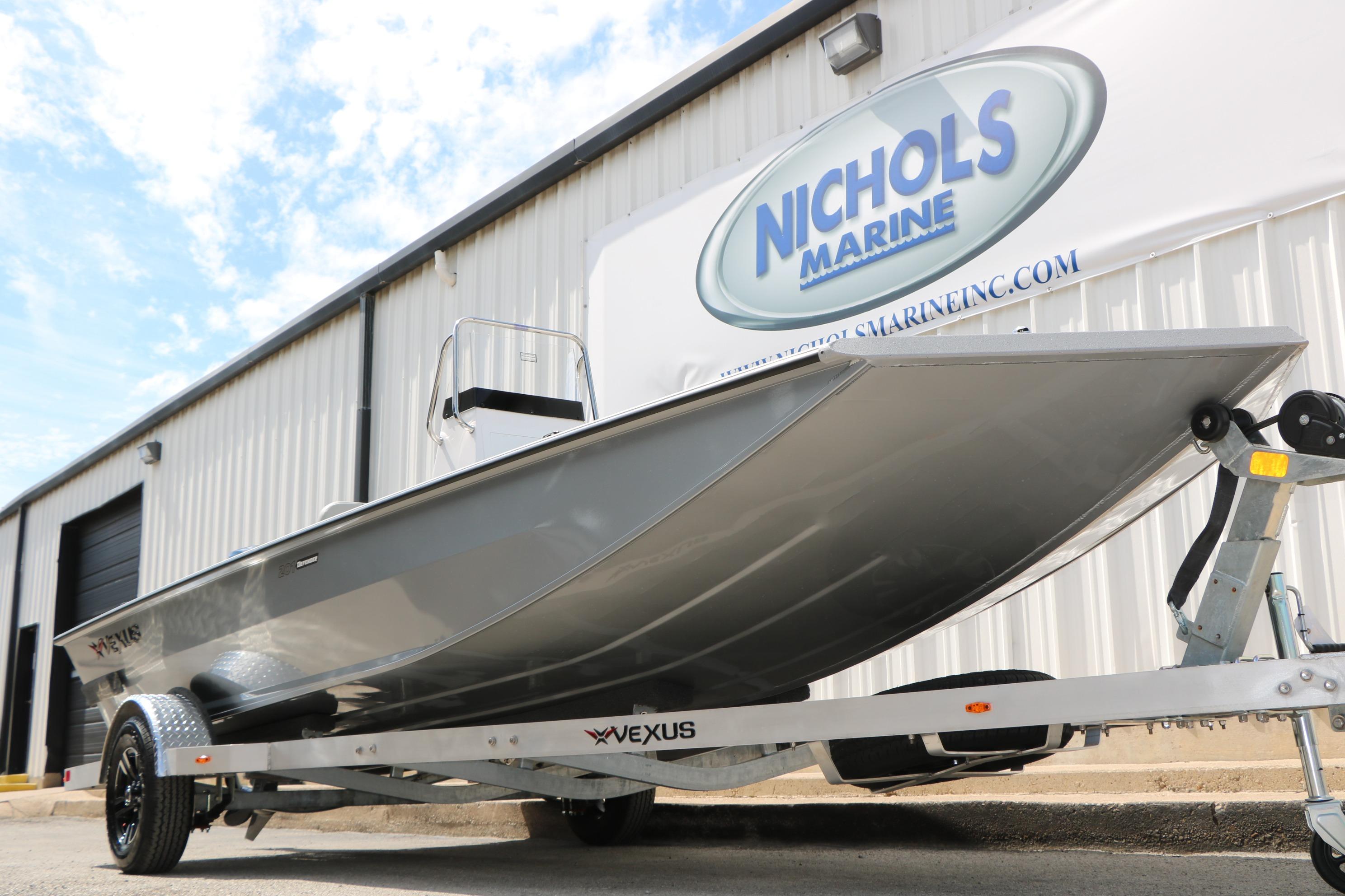 2026 Vexus Defender 201 boat on trailer at Nichols Marine dealership.