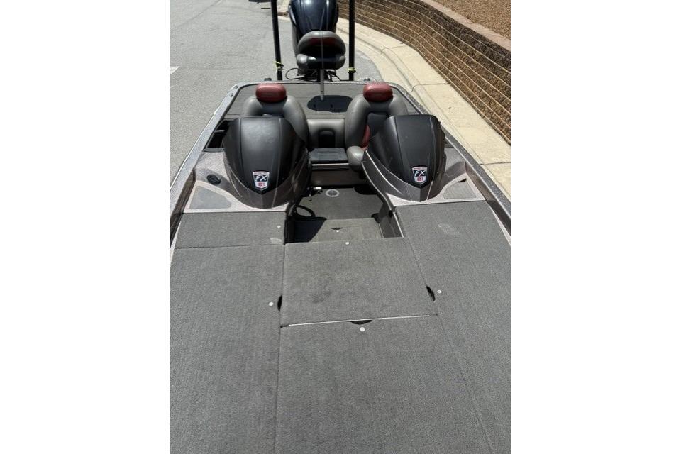 2013 Skeeter FX21 bass boat interior with dual seats and carpeted deck.