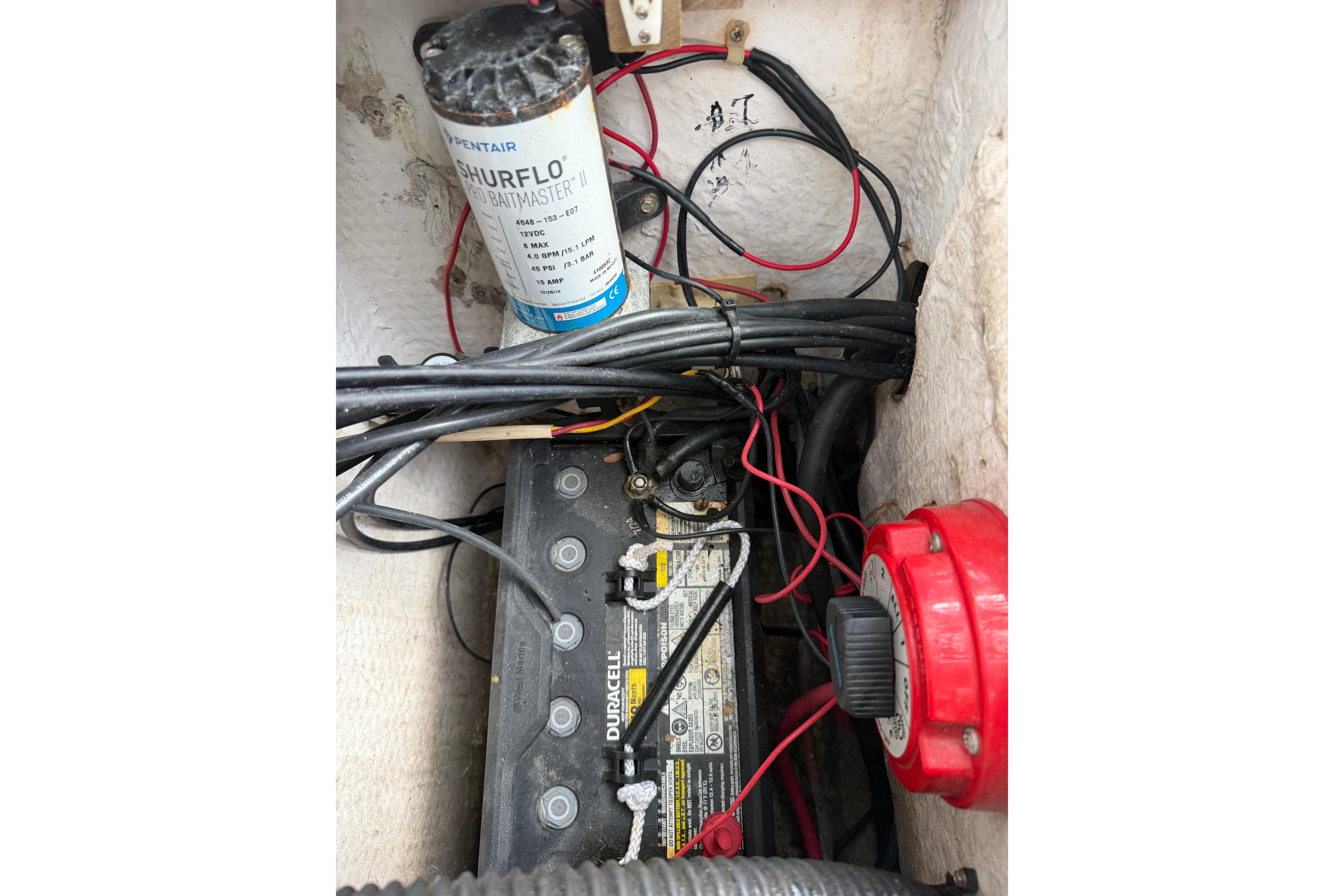 Electrical components and wiring inside a 1987 Grady-White Seafarer 226 boat.
