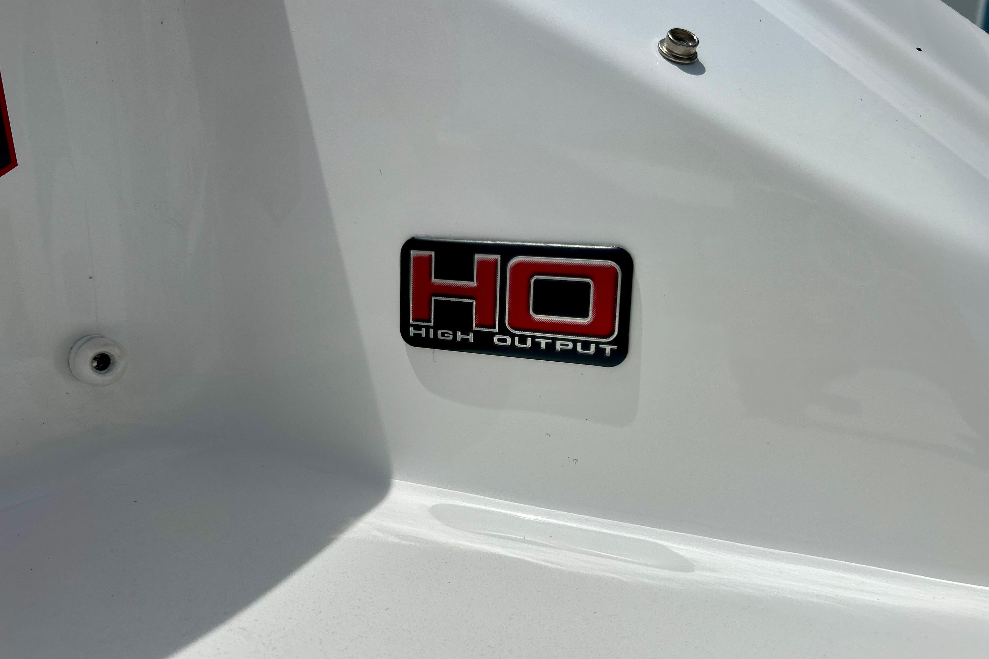 2021 Scarab 195 ID boat with "High Output" emblem on white surface.