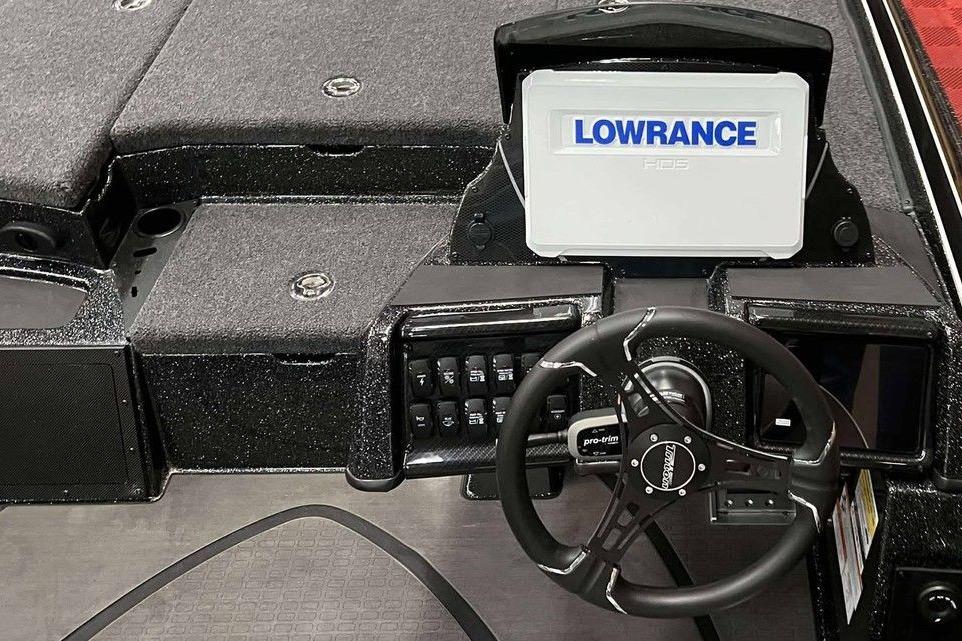 2026 Triton 20XP Patriot boat dashboard with Lowrance display and steering wheel.