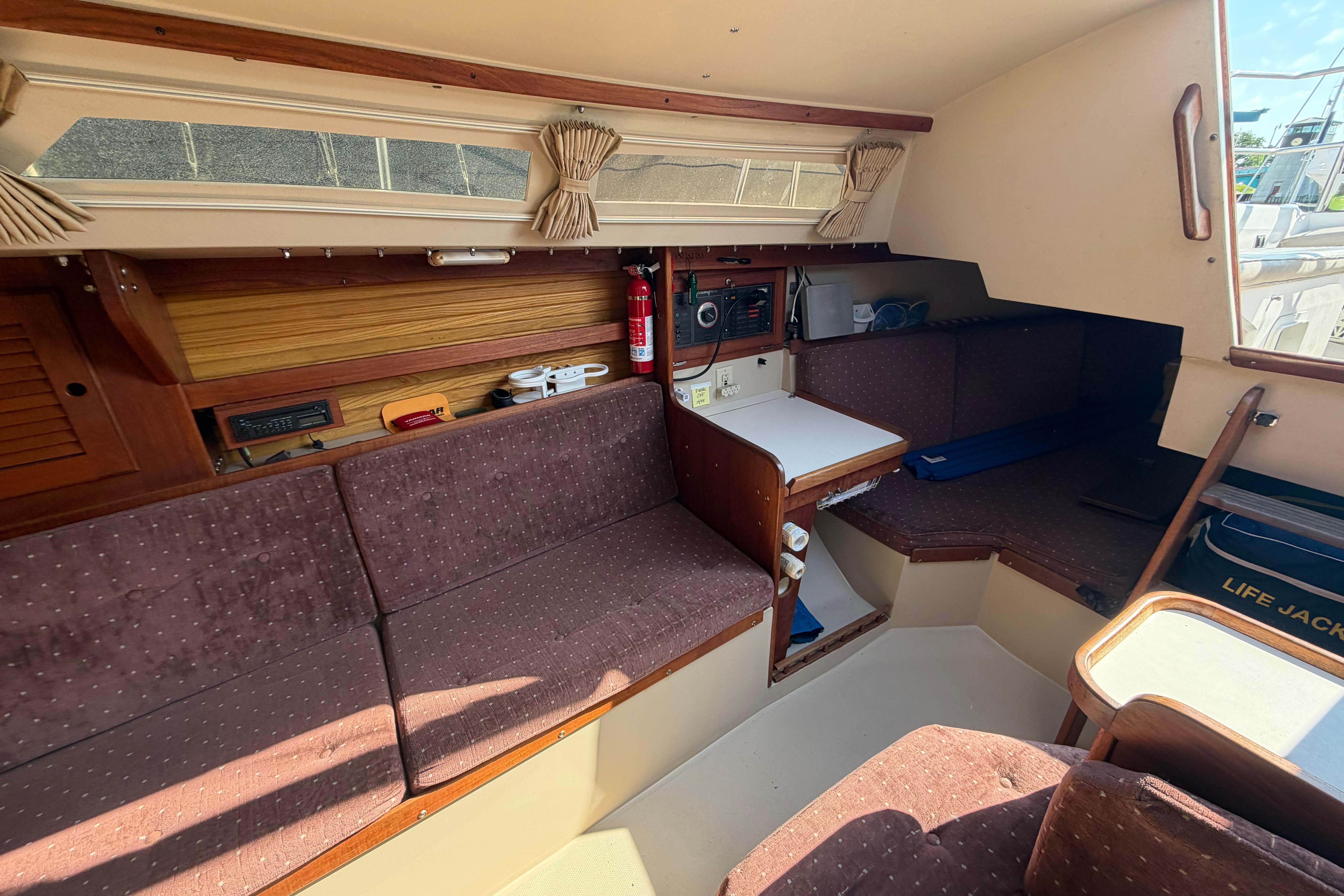 Interior of a 1988 Catalina 30 MkII sailboat with seating and navigation equipment.