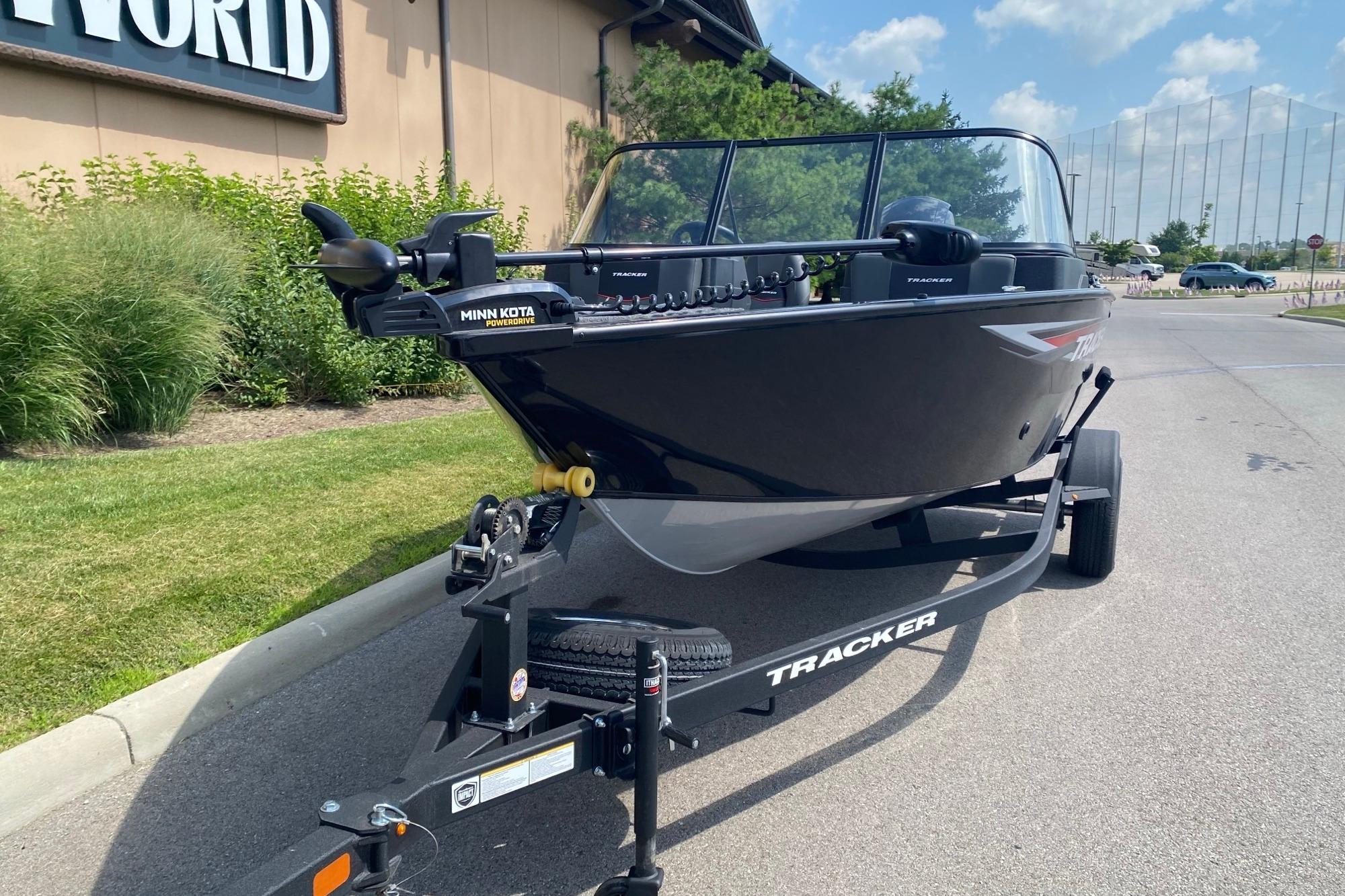 2026 Tracker Pro Guide V-175 Combo boat on trailer, parked outdoors.