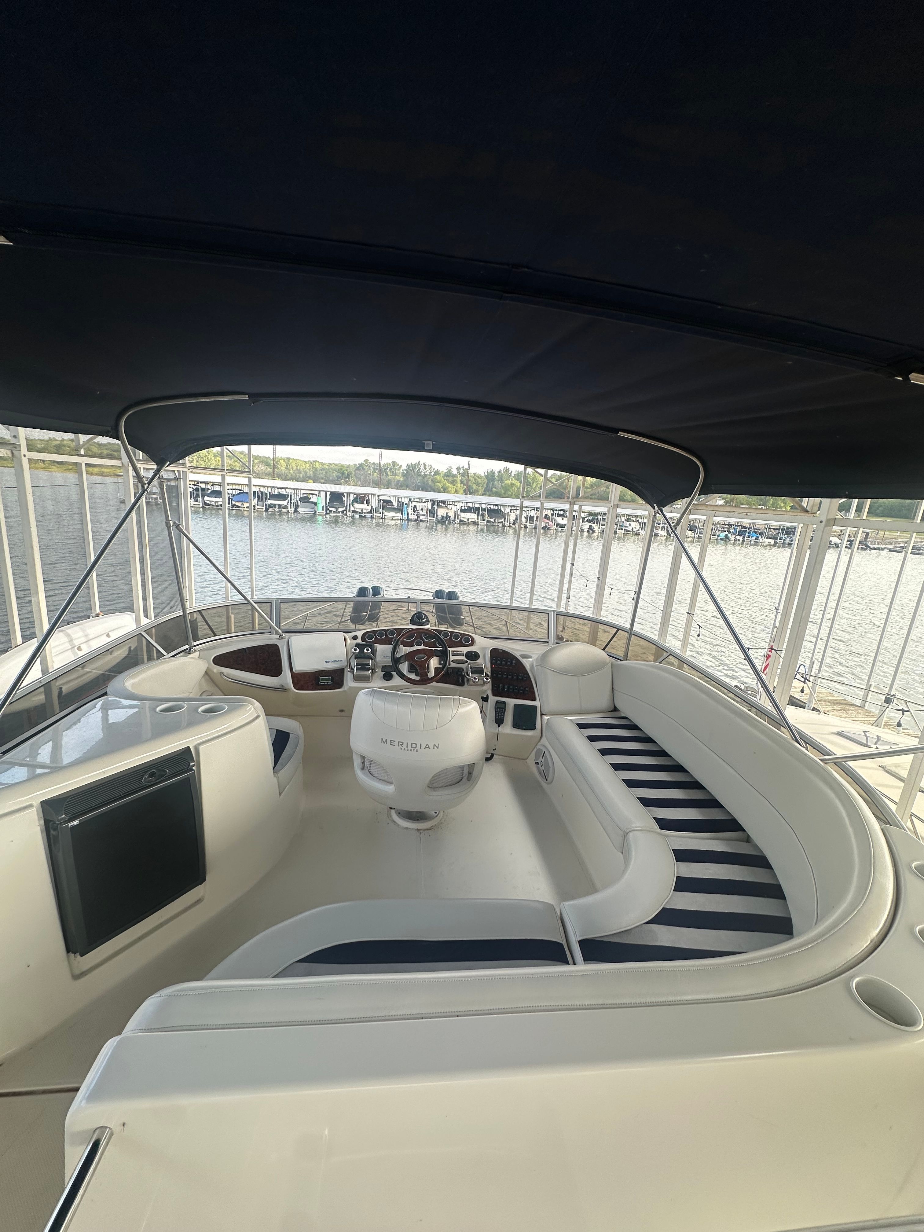 Interior of a 2007 Meridian 459 Motoryacht with helm and seating area.
