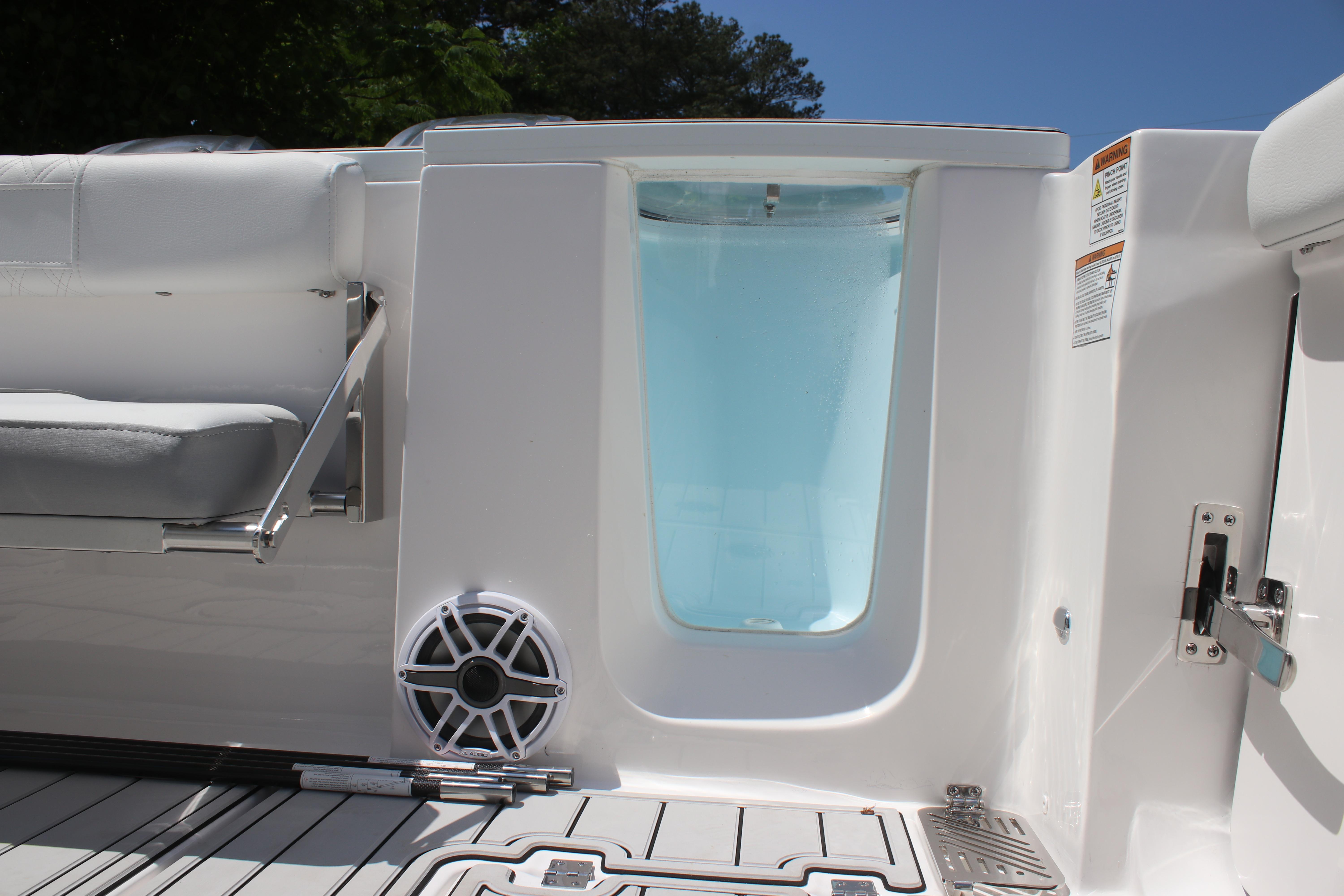 2025 Sea Fox 328 Commander boat interior with seating and speaker detail.