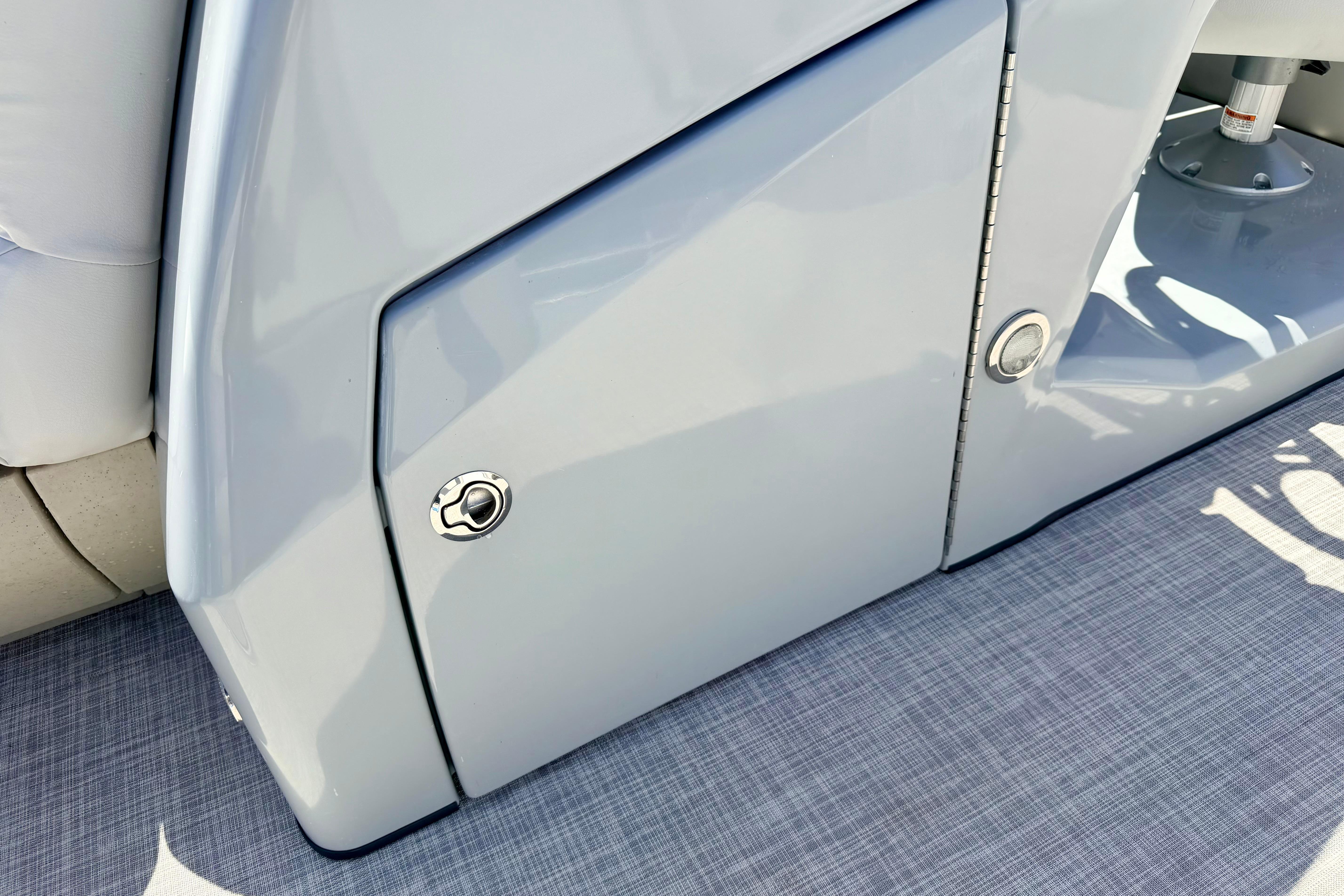 2019 Crestliner 240 Rally DX CW boat interior detail with sleek storage compartment.