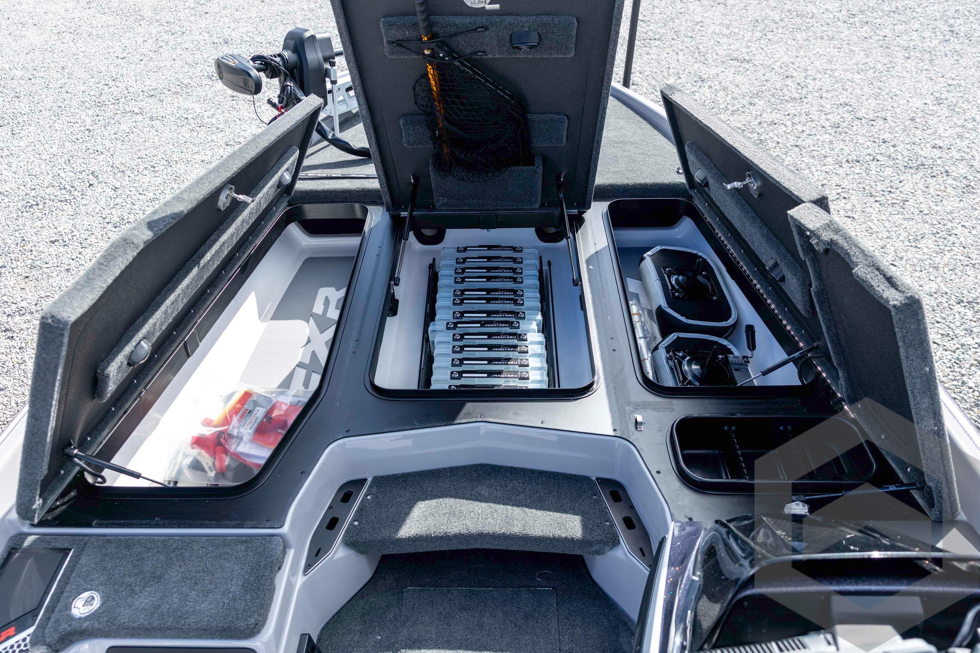2026 Skeeter FXR20 FLEX boat interior storage compartments open, showcasing organized fishing gear.