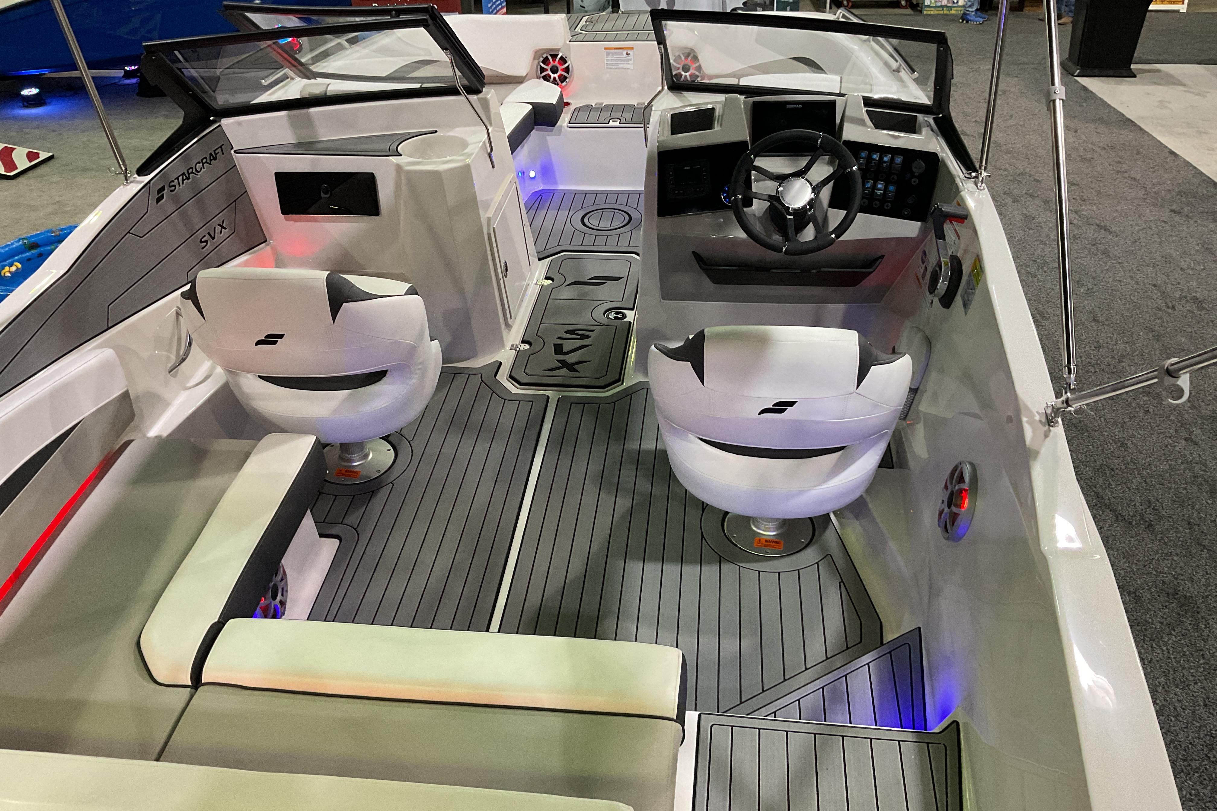 Interior of 2026 Starcraft SVX 210 DC OB boat with modern seating and dashboard.