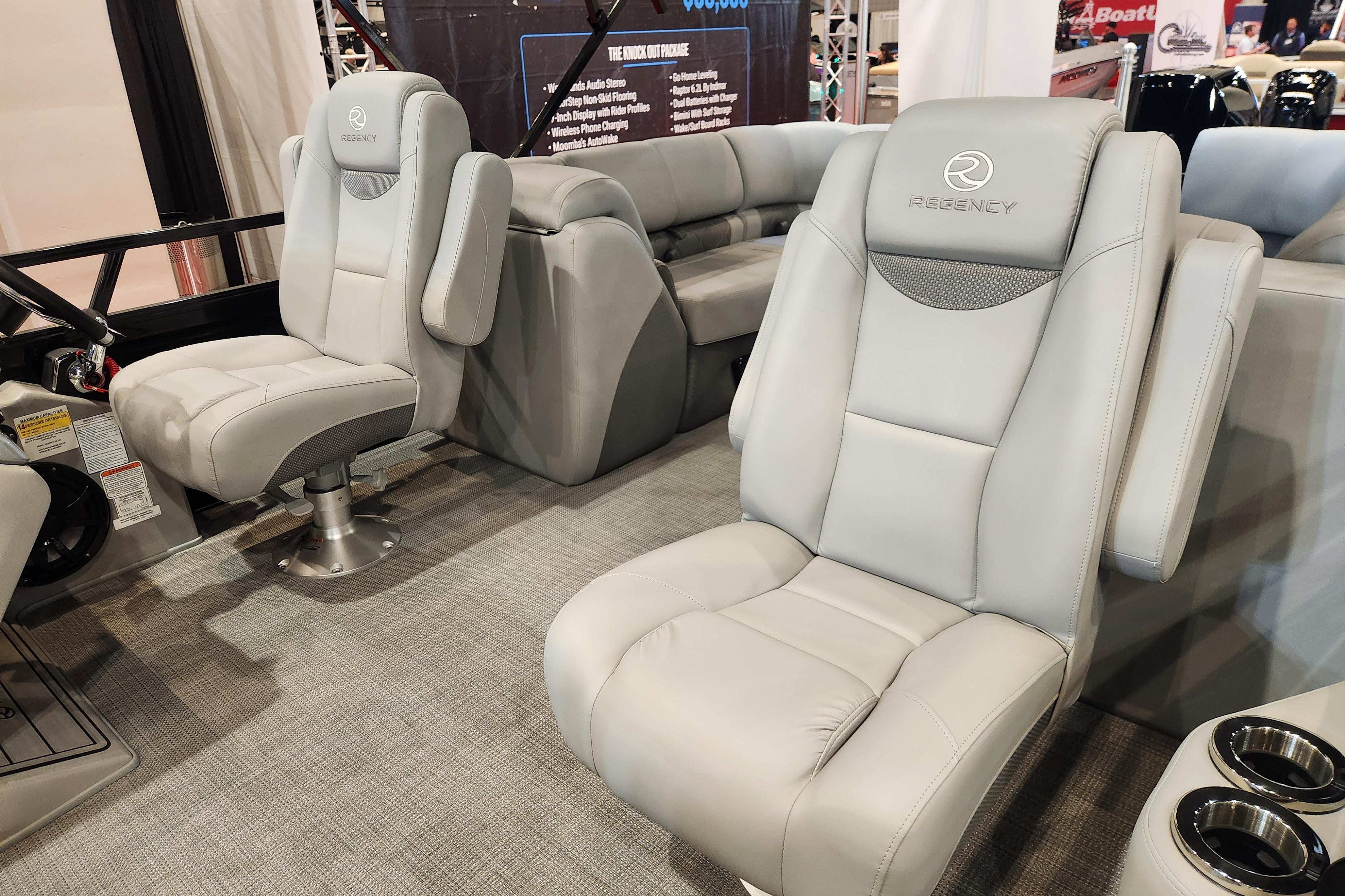 Luxurious seating in 2025 Regency 250 LE3 boat, featuring plush gray upholstery and modern design.