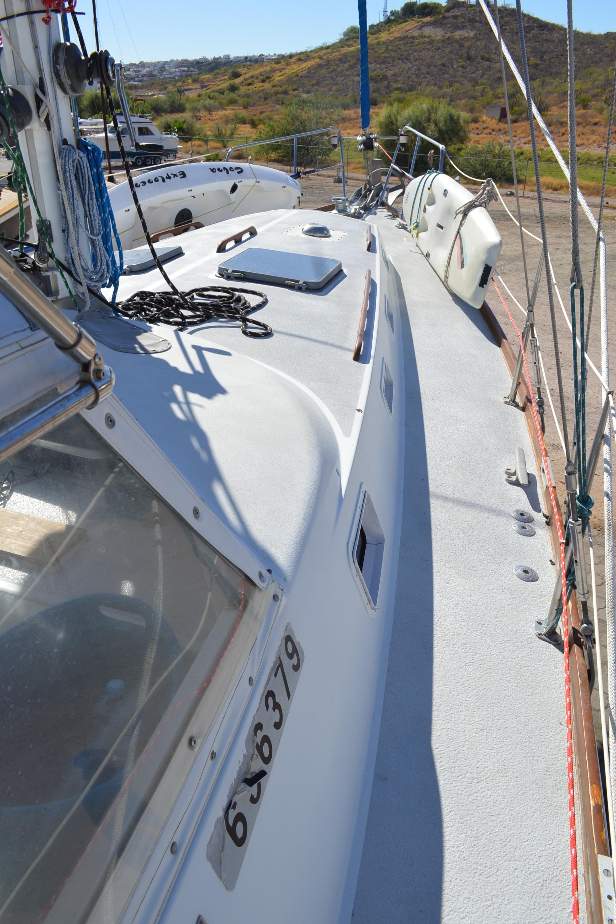 1979 Morgan 461 sailboat deck with rigging and coastal background.