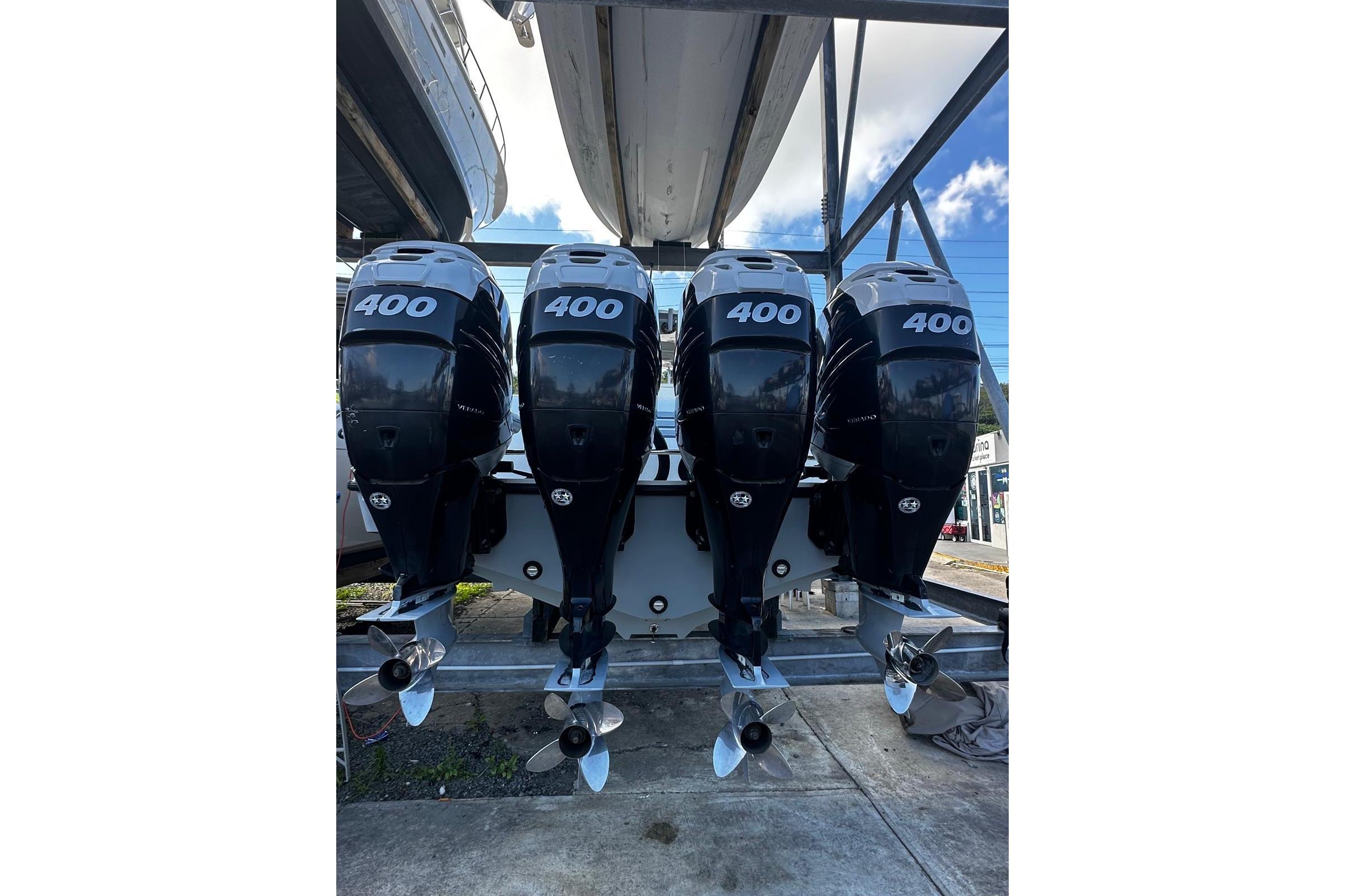 Four powerful outboard motors on a 2020 SeaVee 390Z boat, showcasing 400 horsepower each.