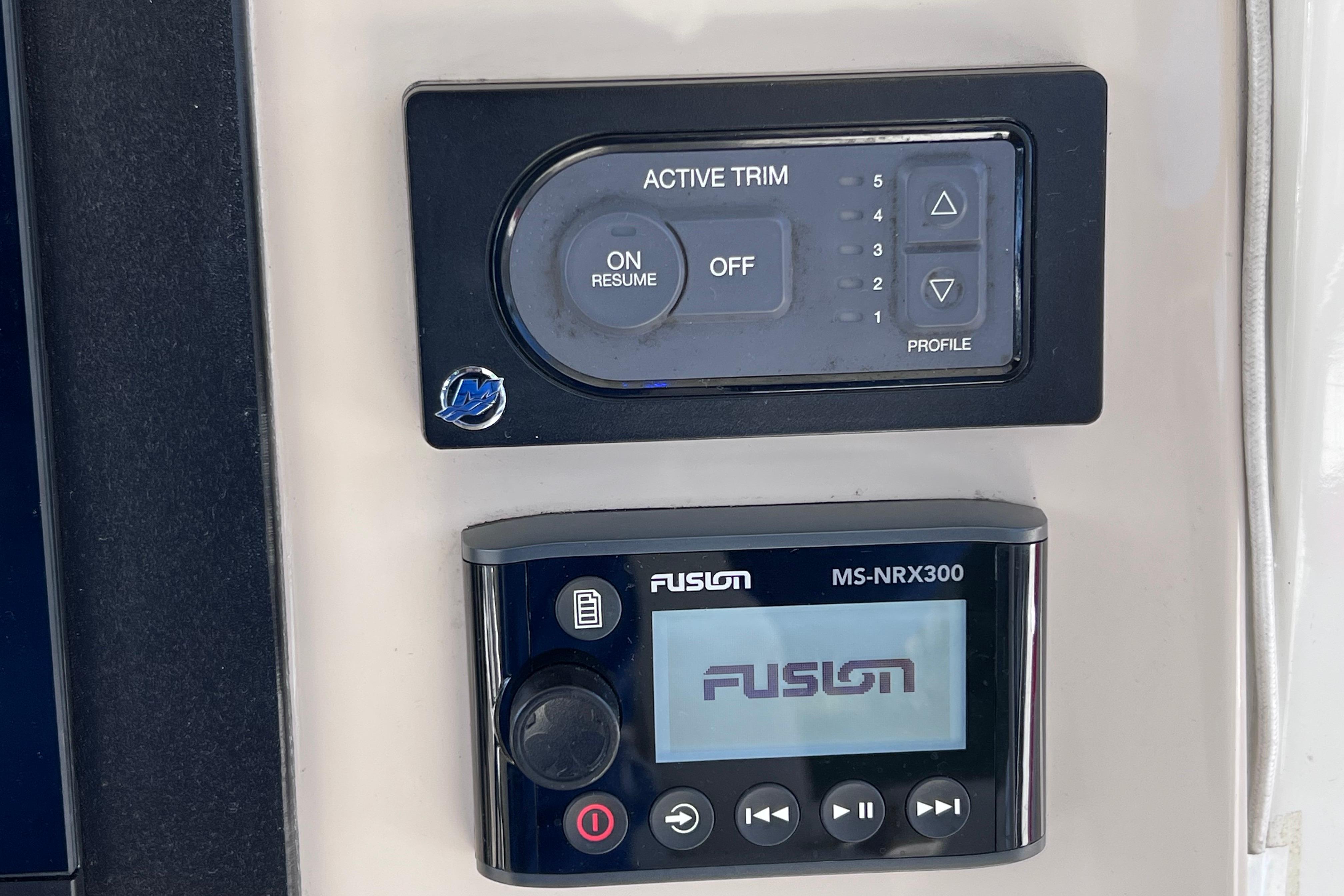 Control panel of a 2021 Boston Whaler 330 Outrage with Fusion MS-NRX300 display.