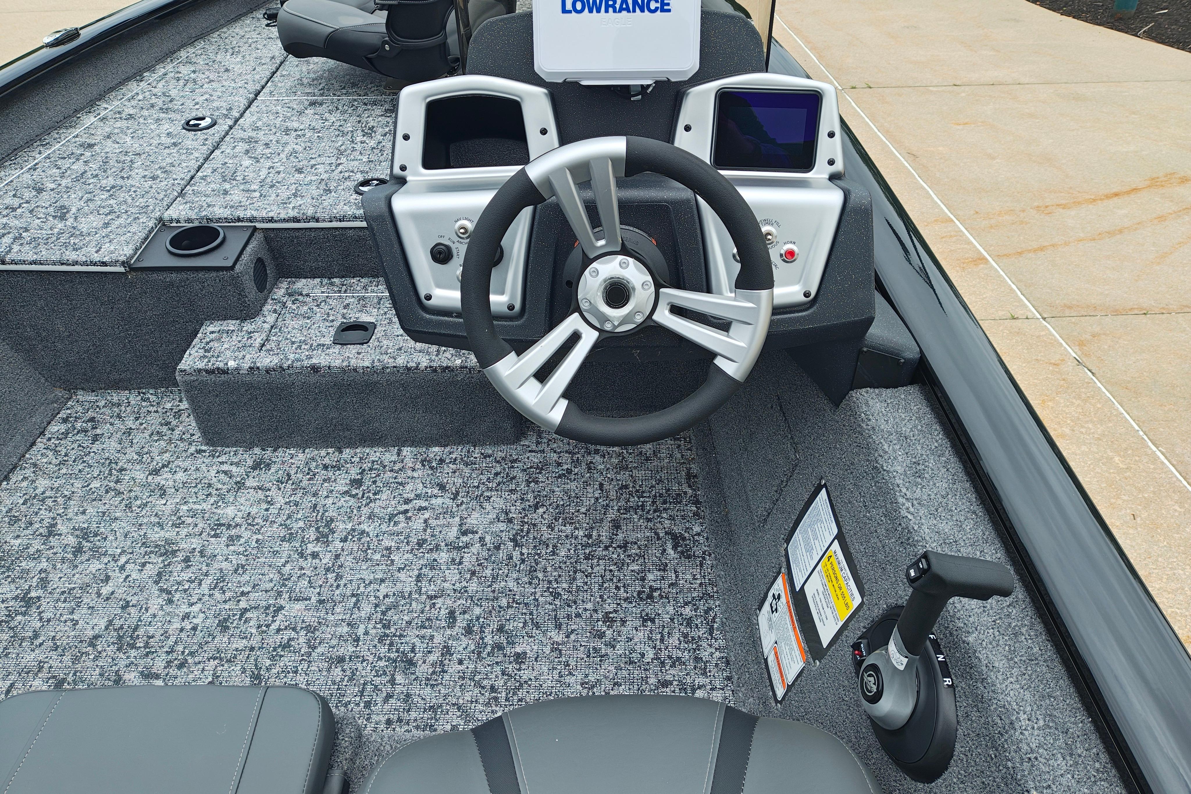 2026 Tracker Pro Team 175 boat interior with steering wheel and control panel.
