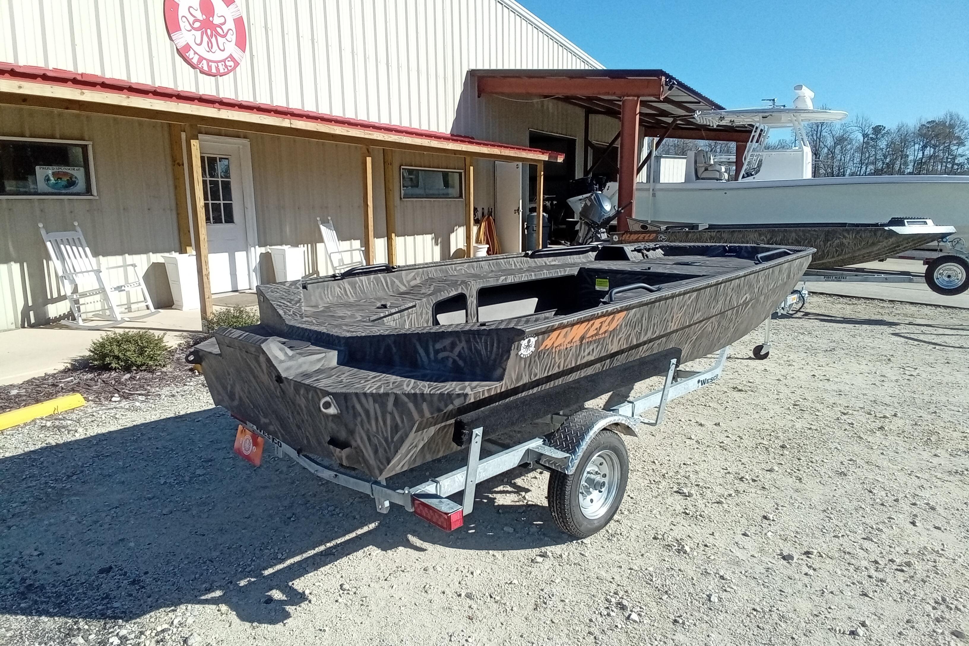 2026 Alweld 1652 Invader boat on trailer outside a building, sunny day.