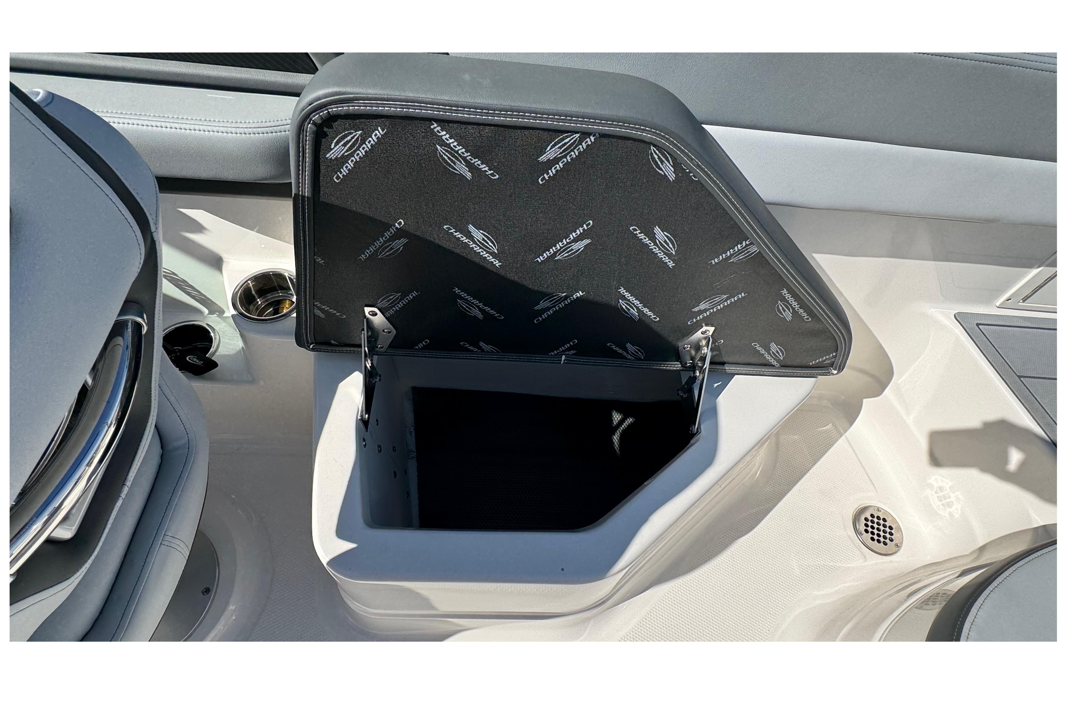 Open storage compartment in 2026 Chaparral SSX 4 boat interior.