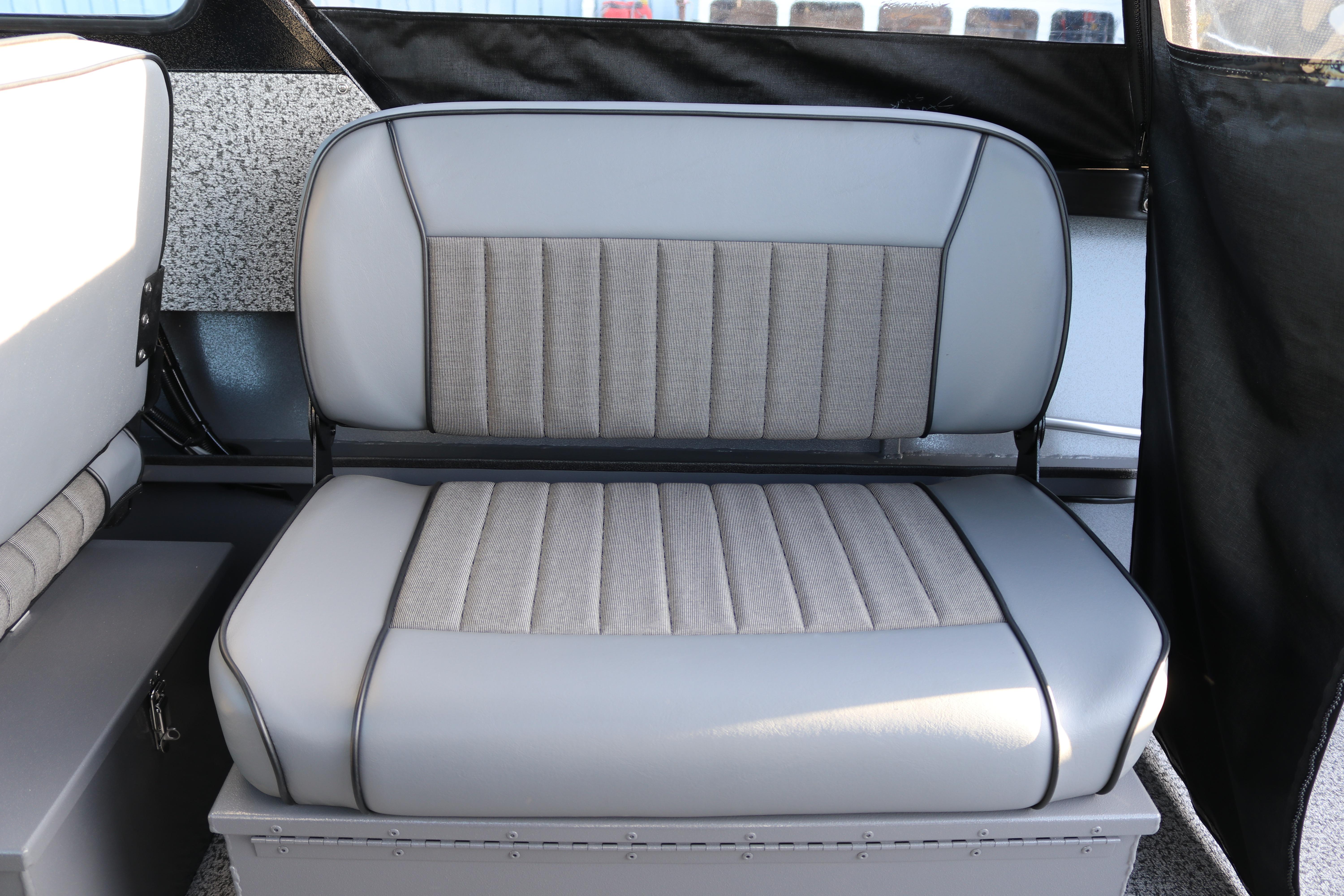 Gray cushioned seat in 2026 Alumaweld Stryker X202 boat interior.
