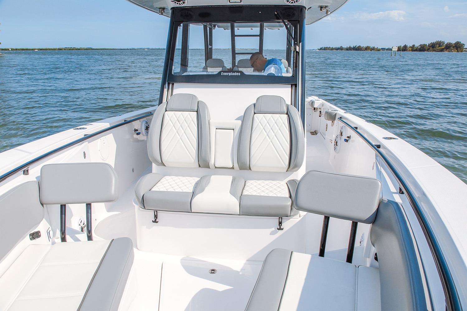 Manufacturer Provided Image: 2026 Everglades 335 Center Console boat interior with luxurious seating on open water.