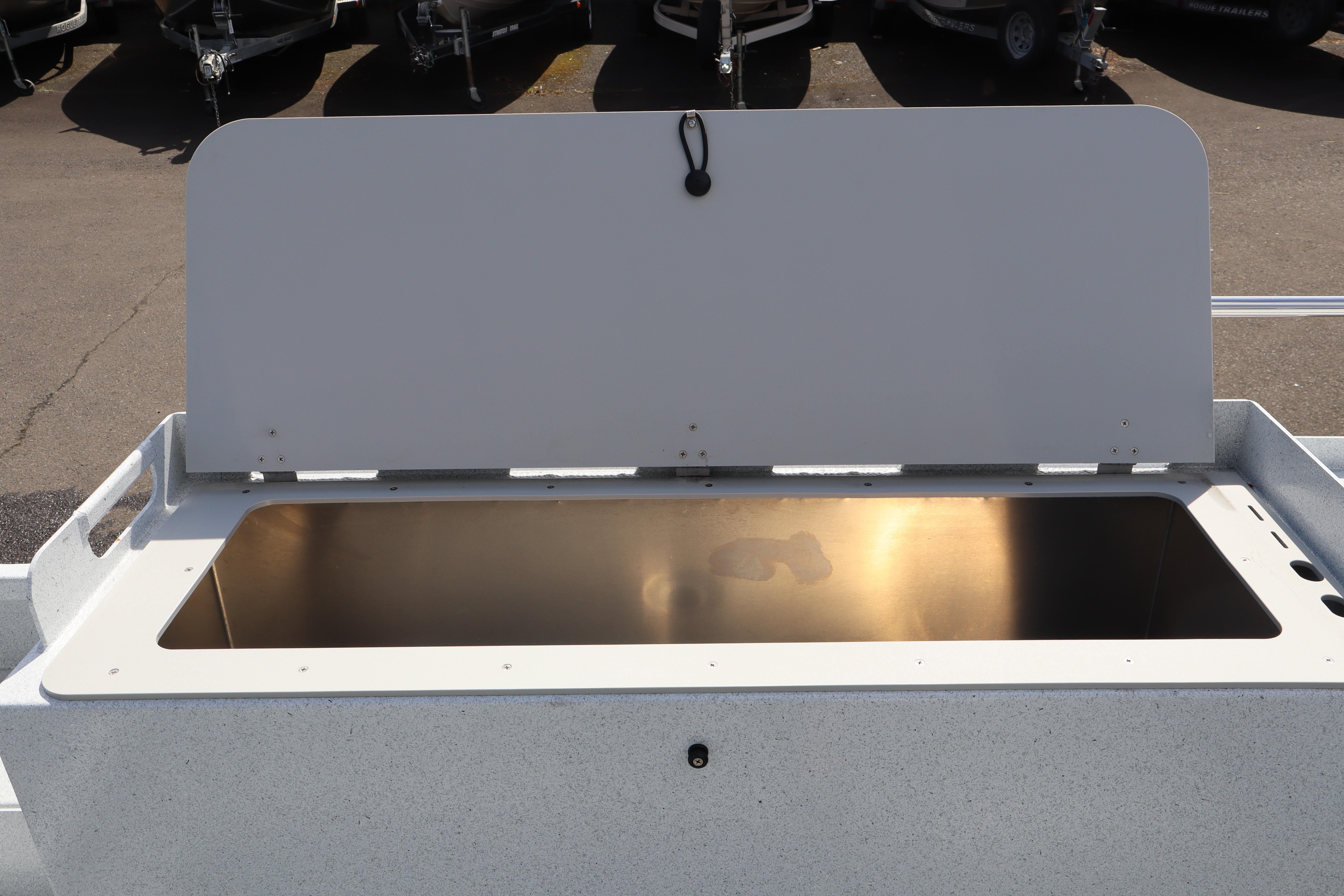 Open storage compartment on 2026 KingFisher 2425 Escape HT boat.
