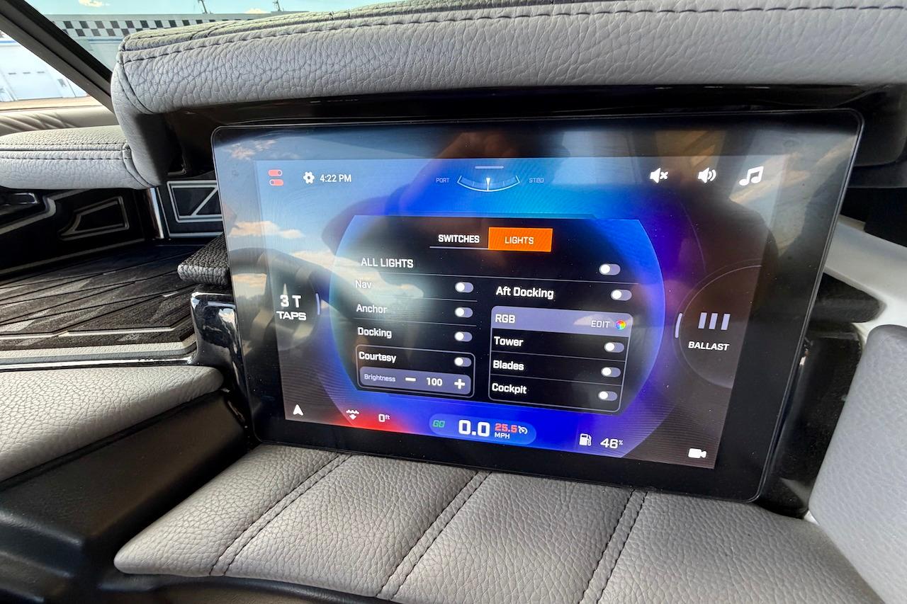Touchscreen control panel in 2025 Tigé Ultré 25ZX boat, displaying lighting and ballast settings.