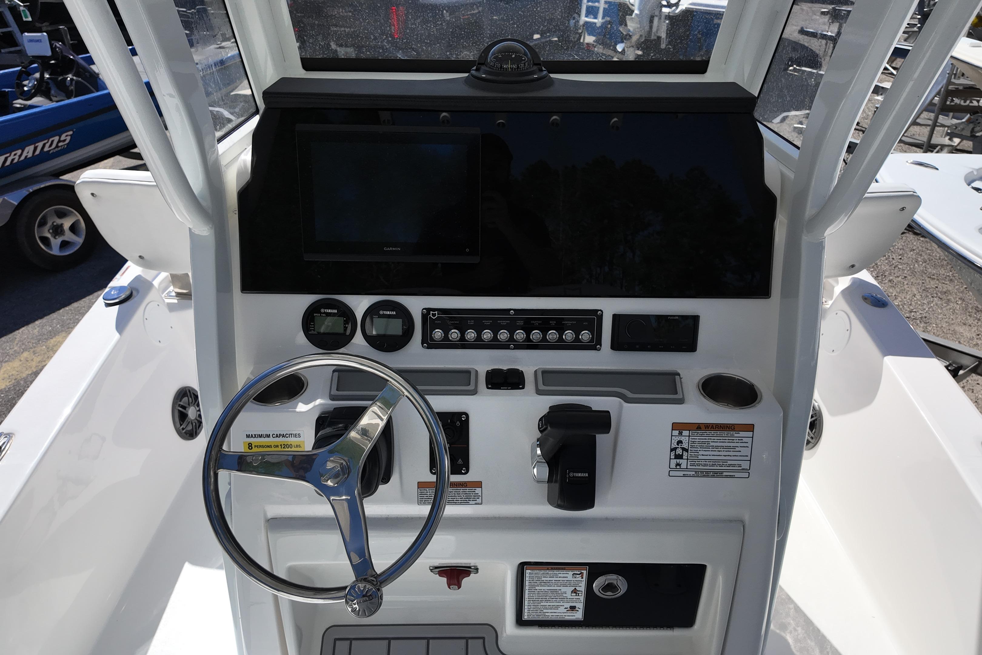 2026 Sea Fox 251 Bay Fox boat console with steering wheel and navigation controls.