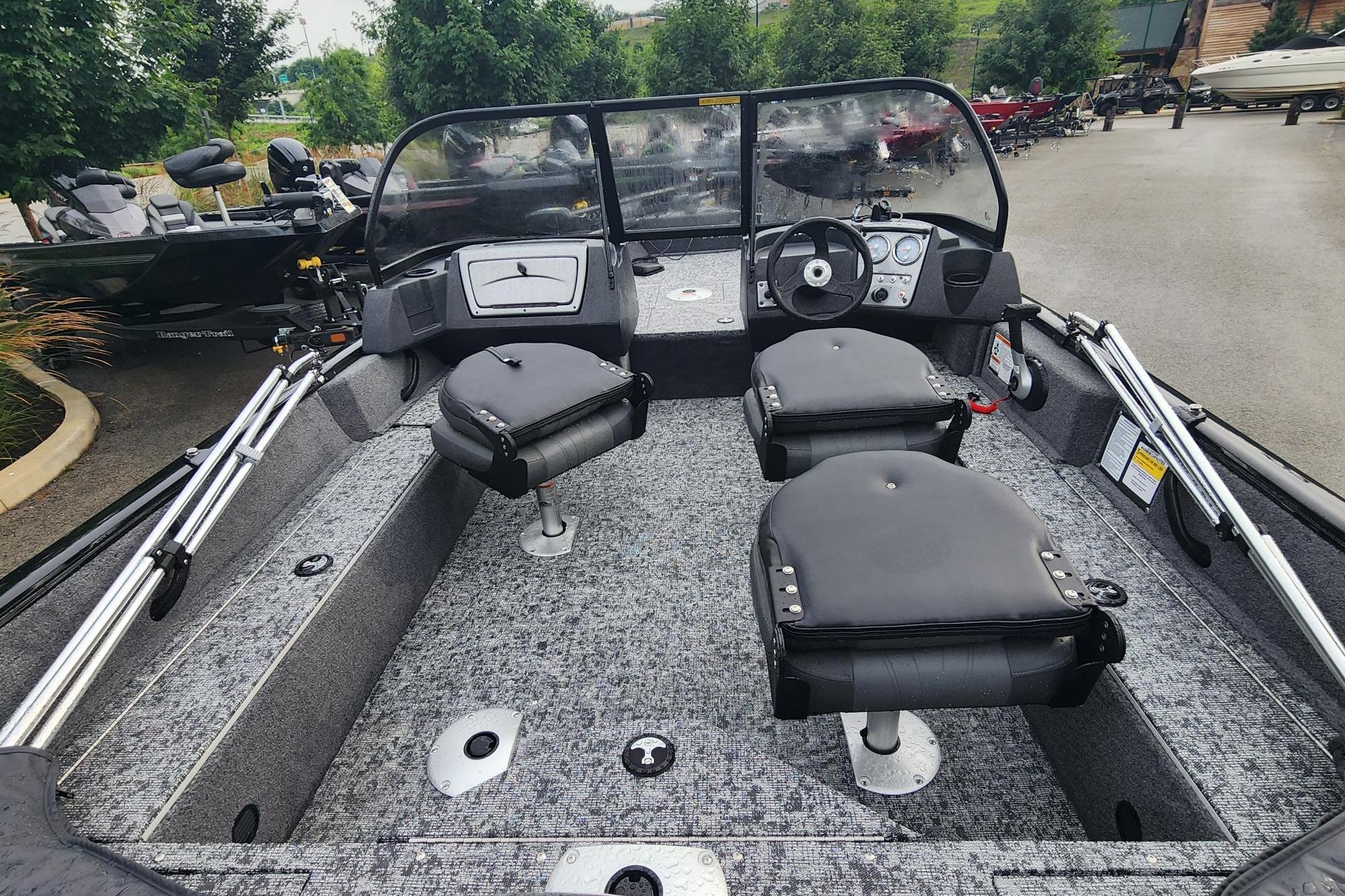2026 Tracker Pro Guide V-16 WT boat interior with seating and steering console.